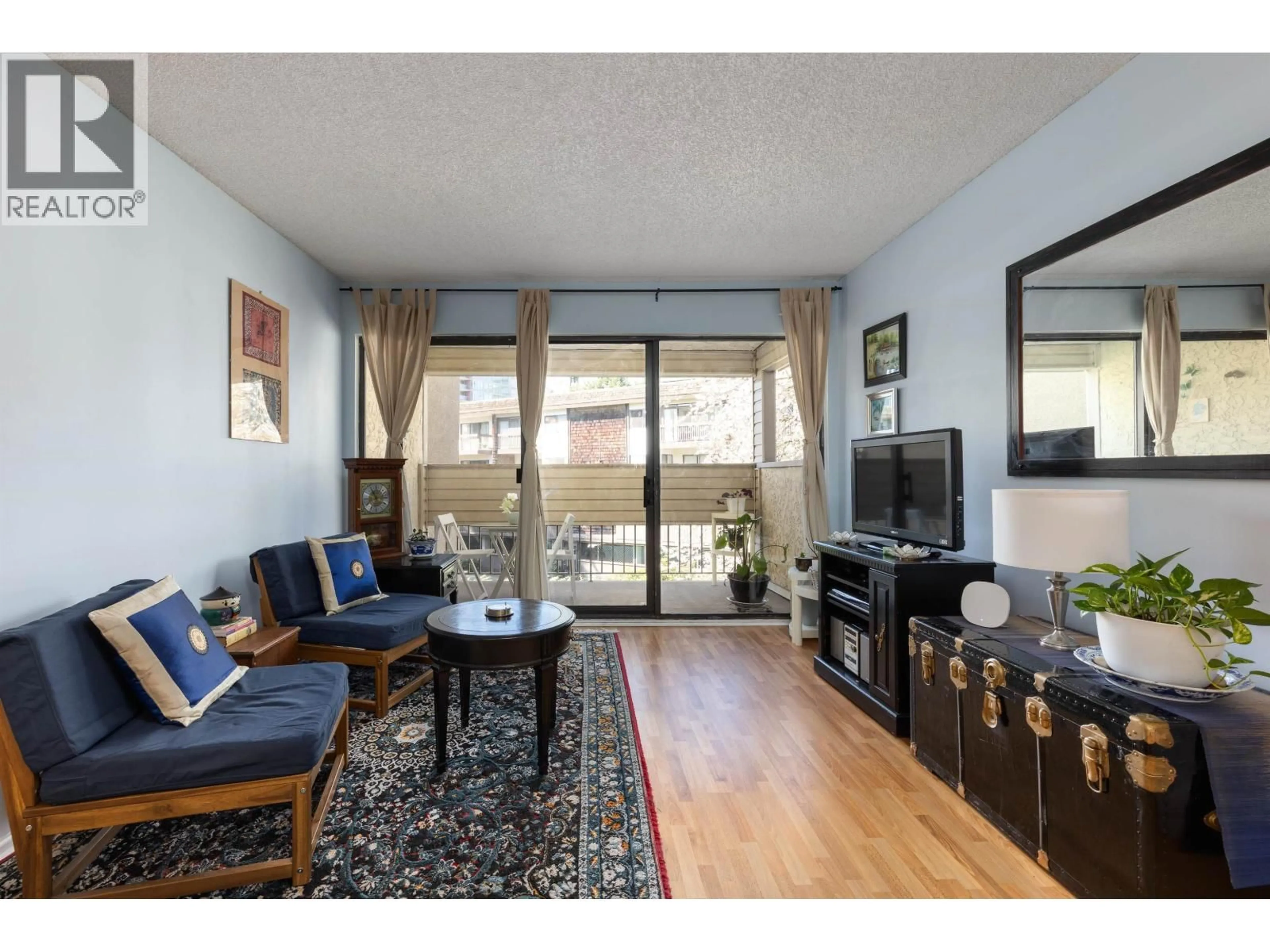 Living room with furniture, wood/laminate floor for 212 - 8291 PARK ROAD, Richmond British Columbia V6Y1T3
