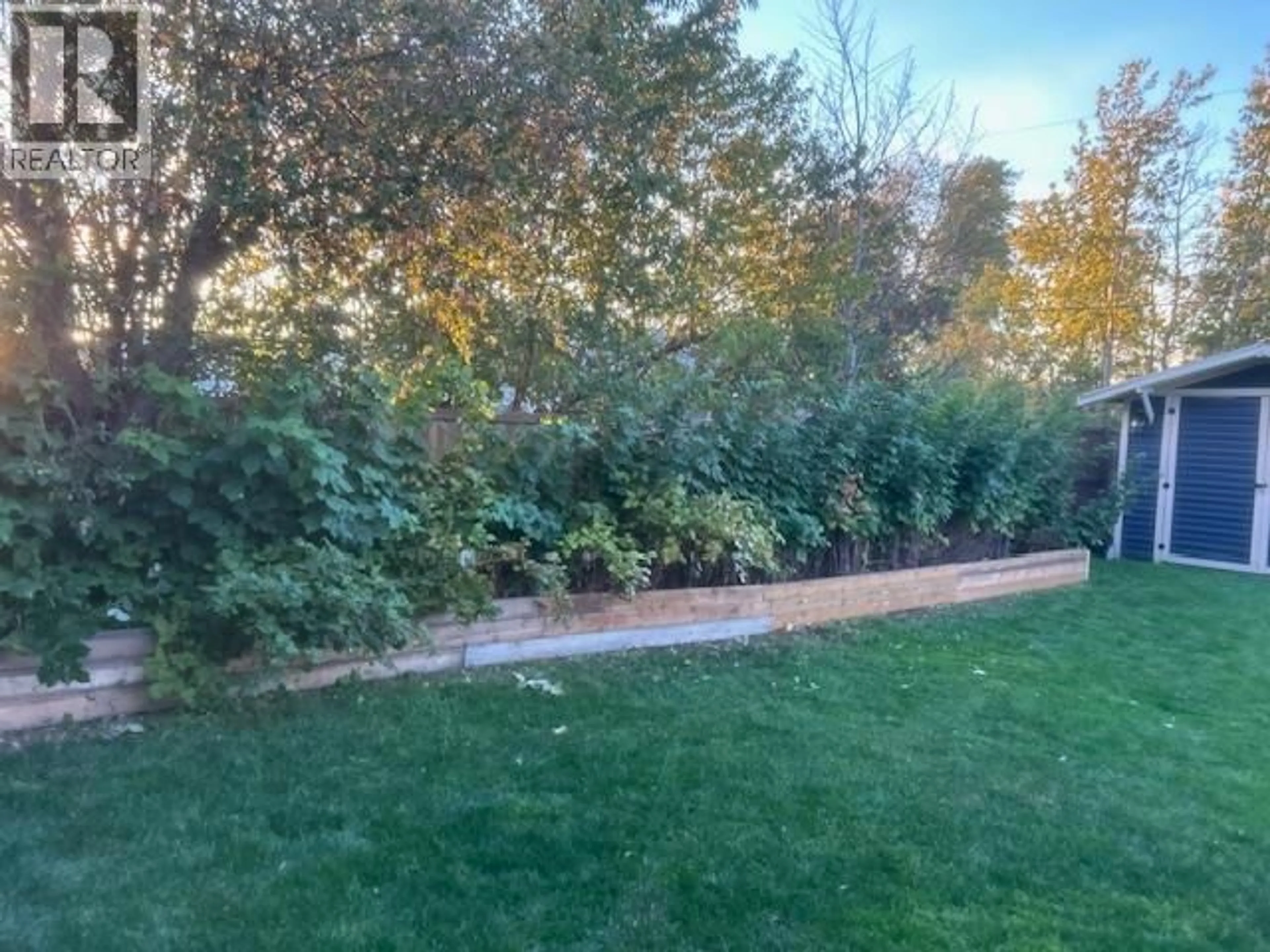 A pic from outside/outdoor area/front of a property/back of a property/a pic from drone, forest/trees view for 9508 114A AVENUE, Fort St. John British Columbia V1J2X5