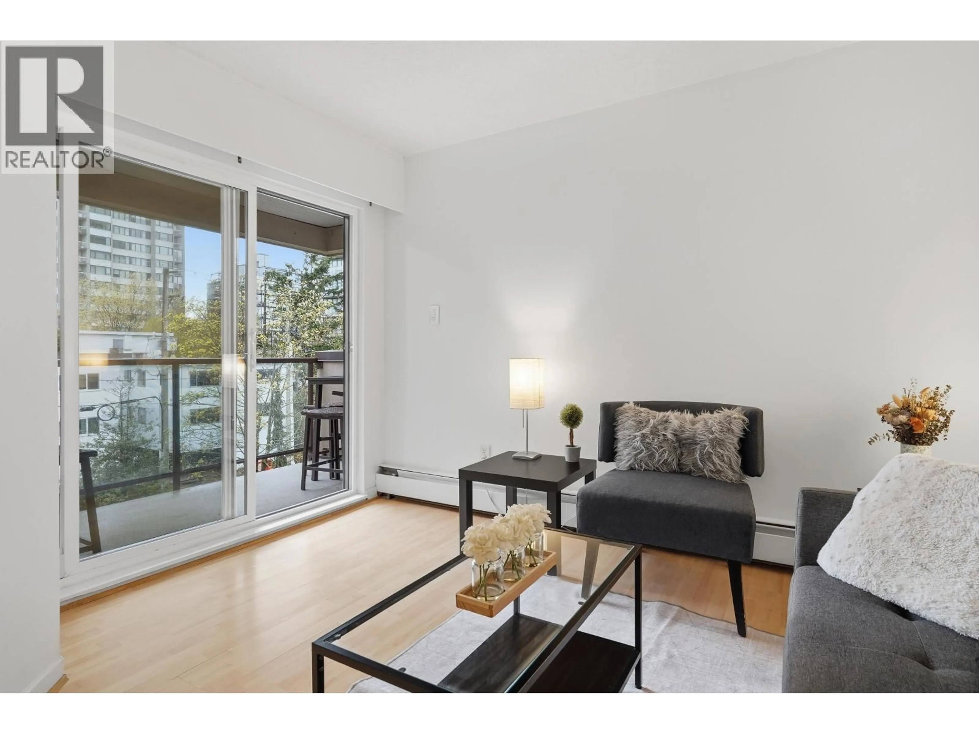 Living room with furniture, wood/laminate floor for 412 - 1718 NELSON STREET, Vancouver British Columbia V6G1M8