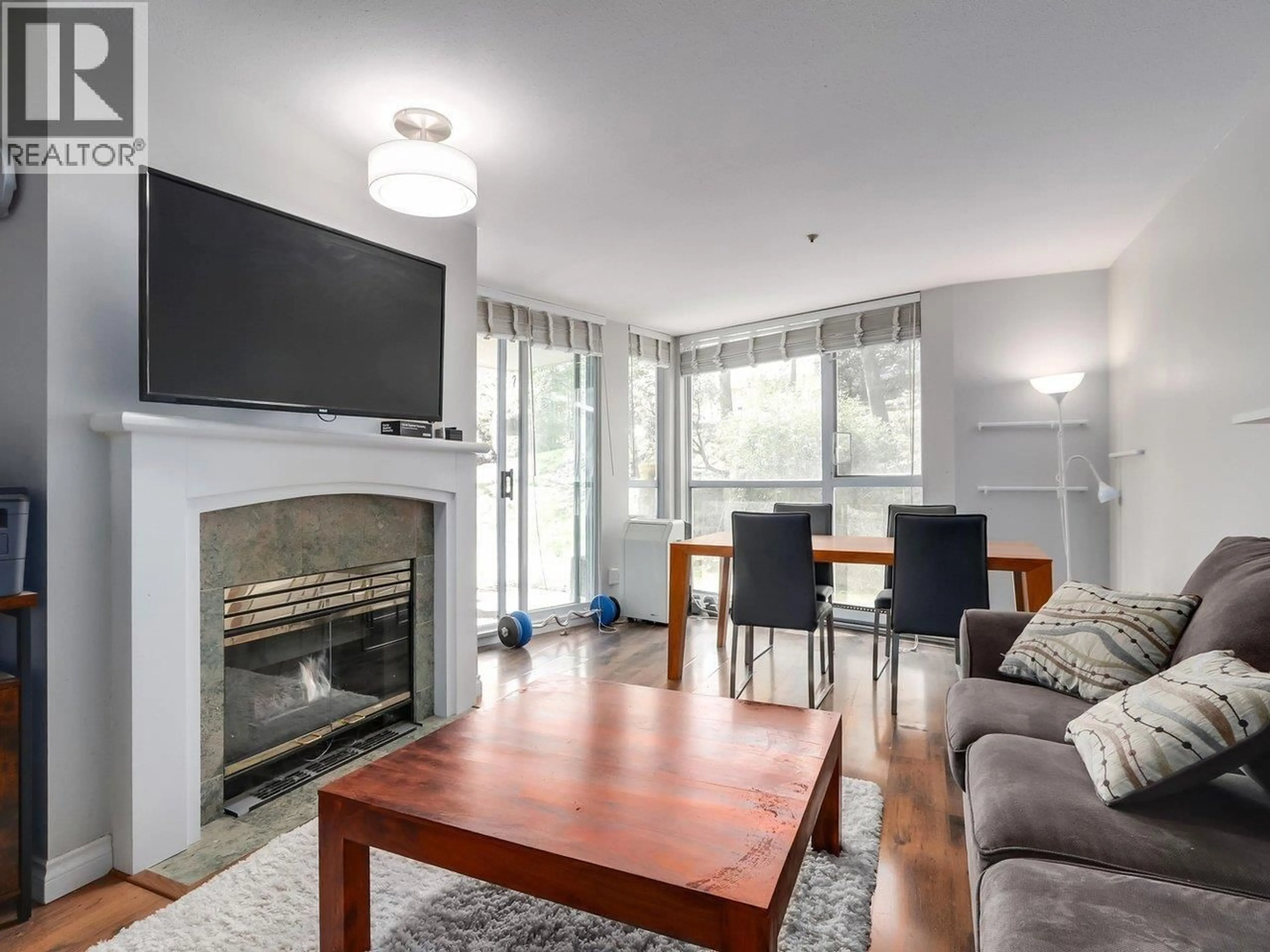 Living room with furniture, wood/laminate floor for 3 - 8420 JELLICOE STREET, Vancouver British Columbia V5S4T1