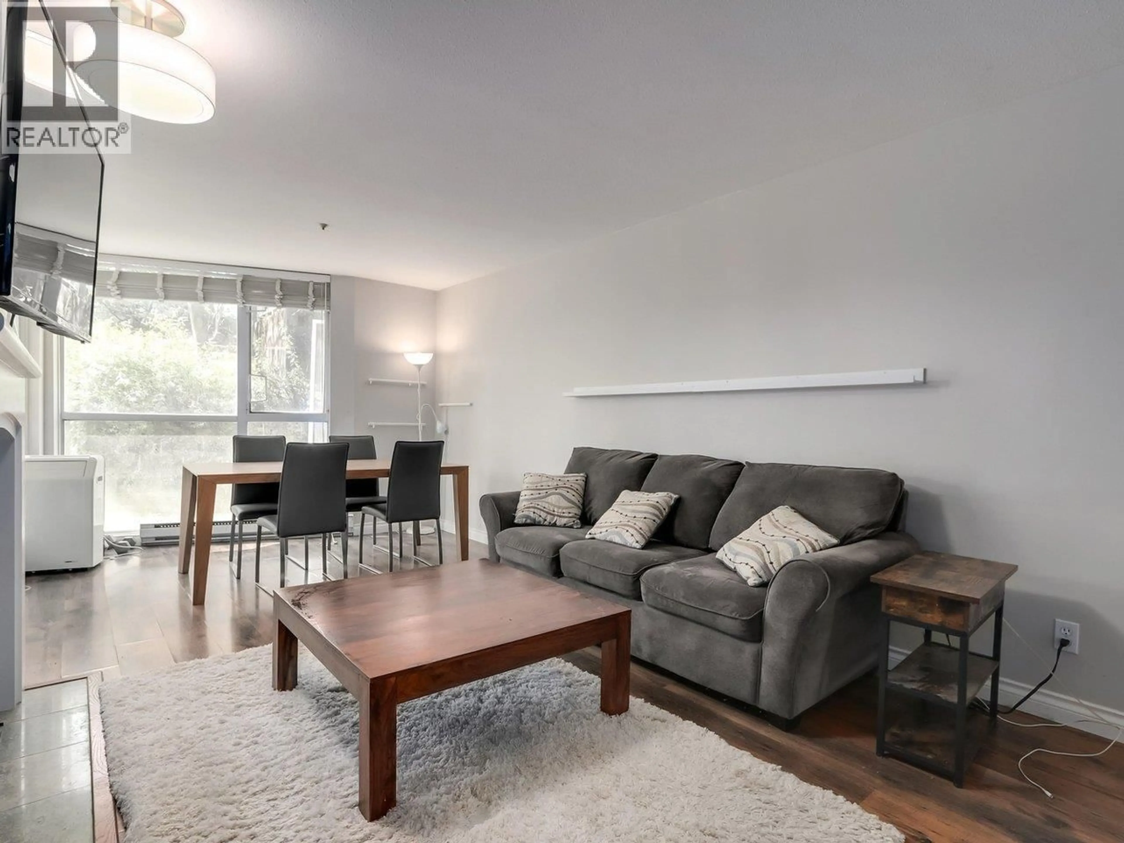 Living room with furniture, wood/laminate floor for 3 - 8420 JELLICOE STREET, Vancouver British Columbia V5S4T1