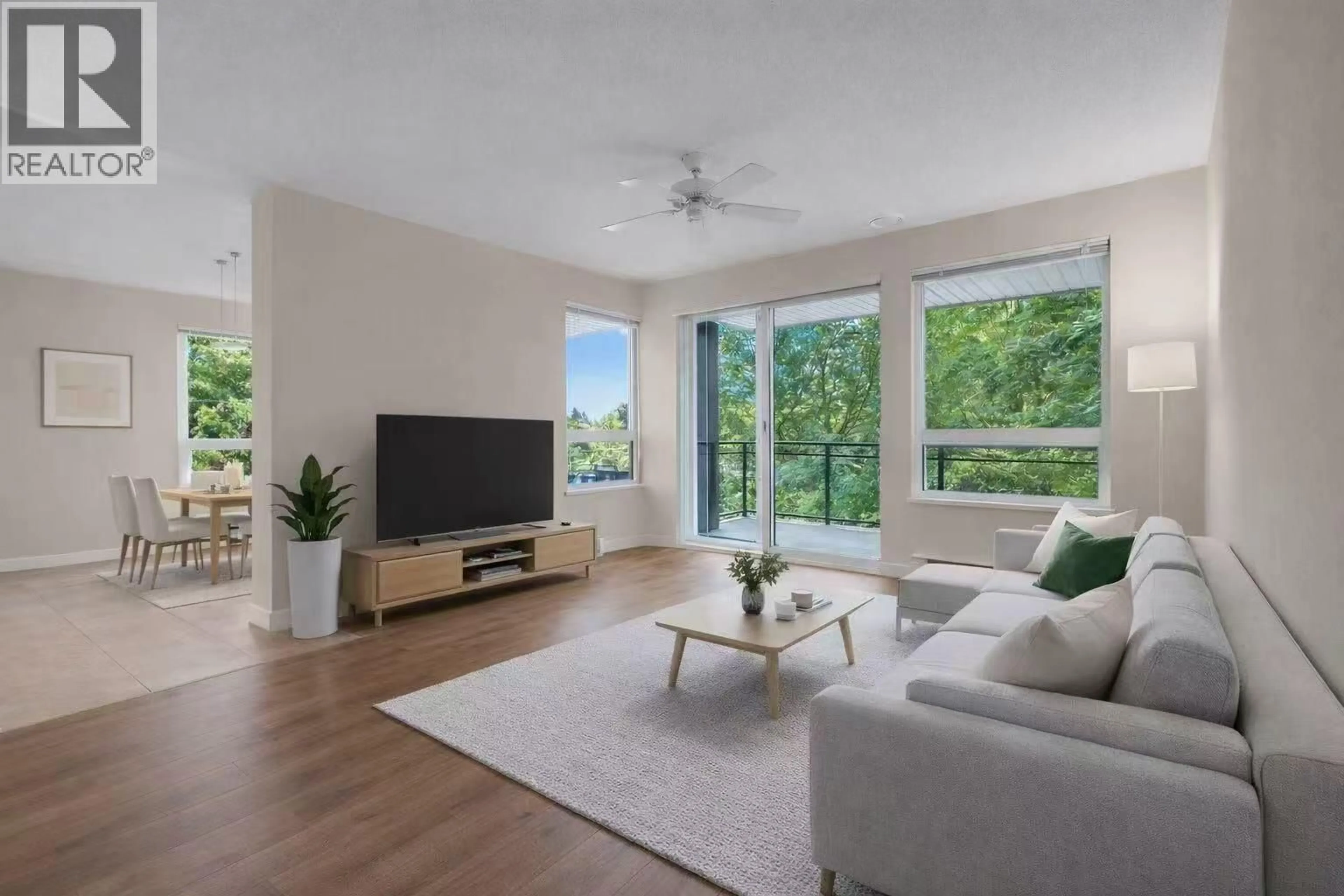 Living room with furniture, wood/laminate floor for 205 - 9500 ODLIN ROAD, Richmond British Columbia V6X0H5