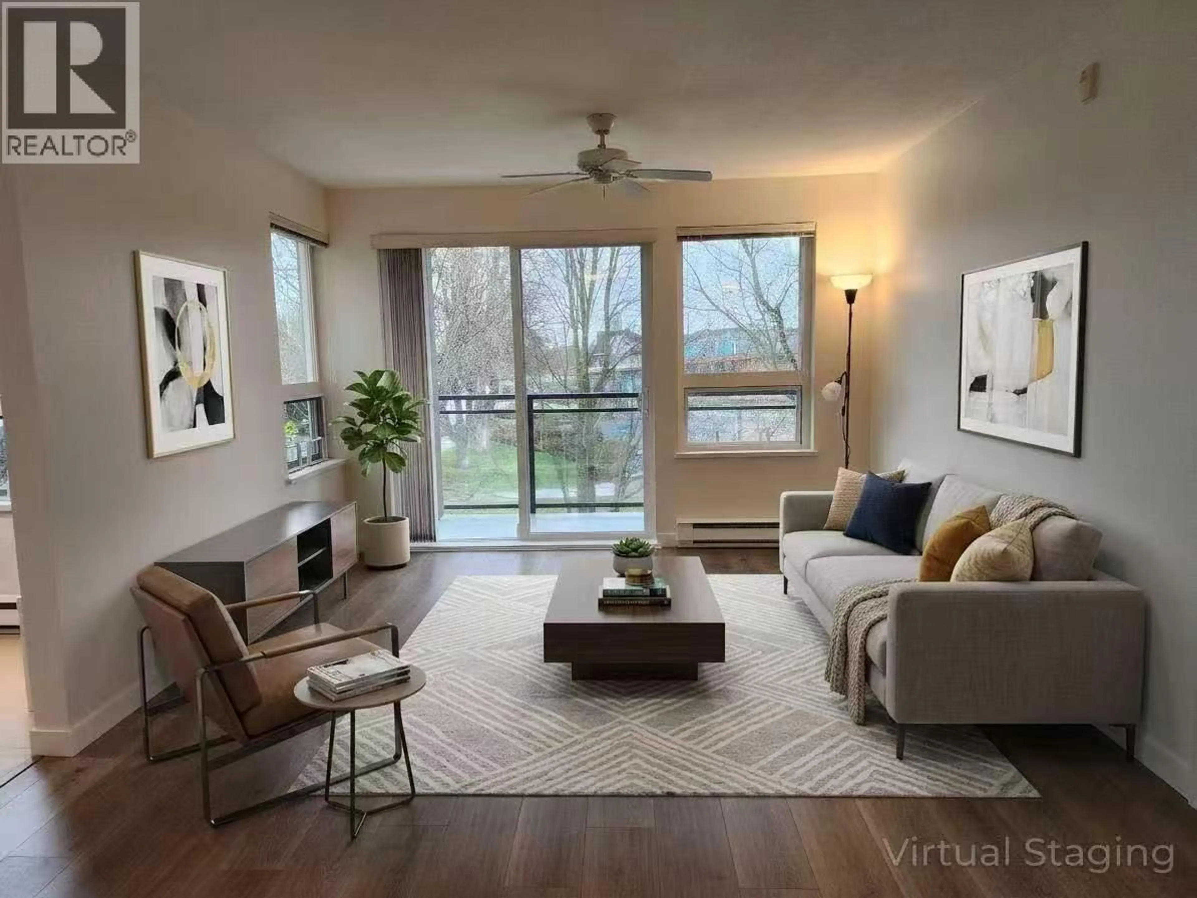 Living room with furniture, wood/laminate floor for 205 - 9500 ODLIN ROAD, Richmond British Columbia V6X0H5
