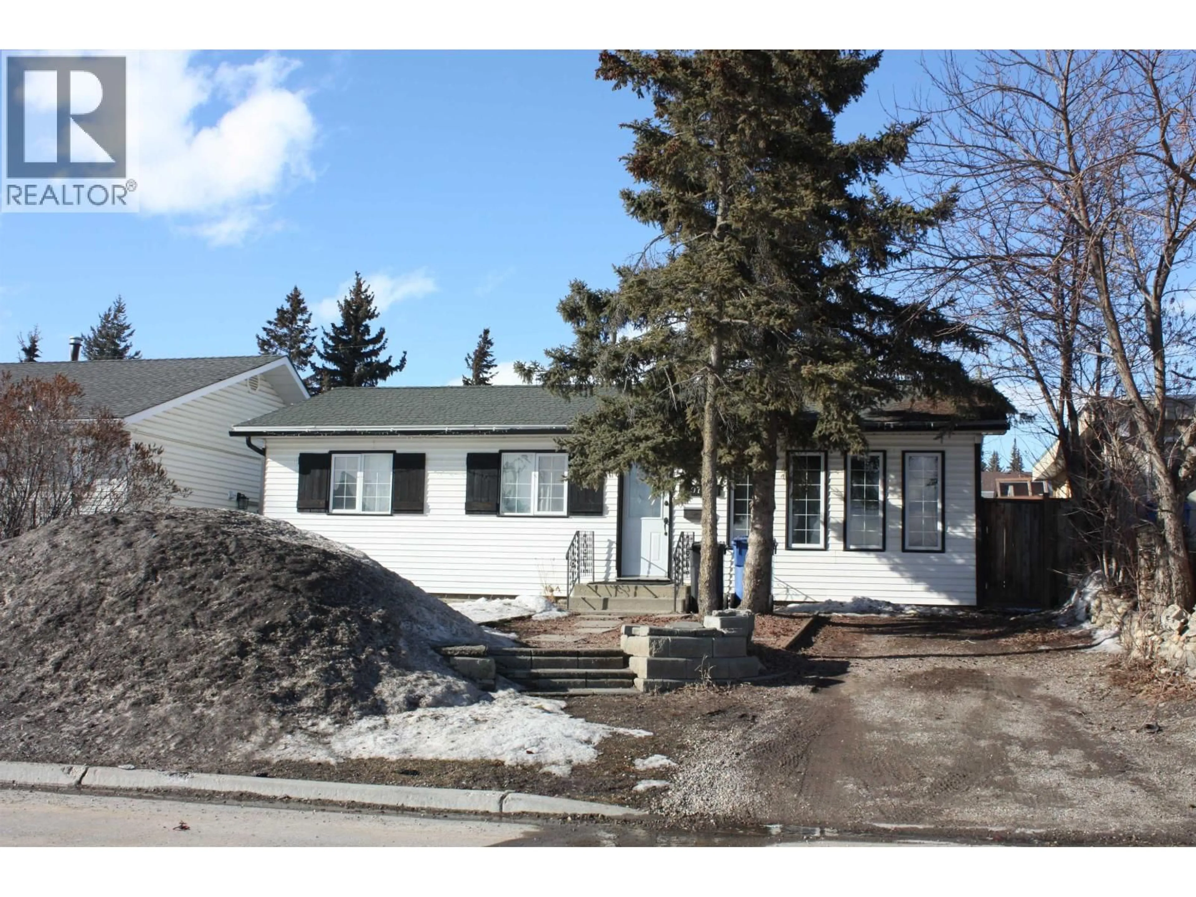 Home with vinyl exterior material, street for 10704 102 AVENUE, Fort St. John British Columbia V1J2E8