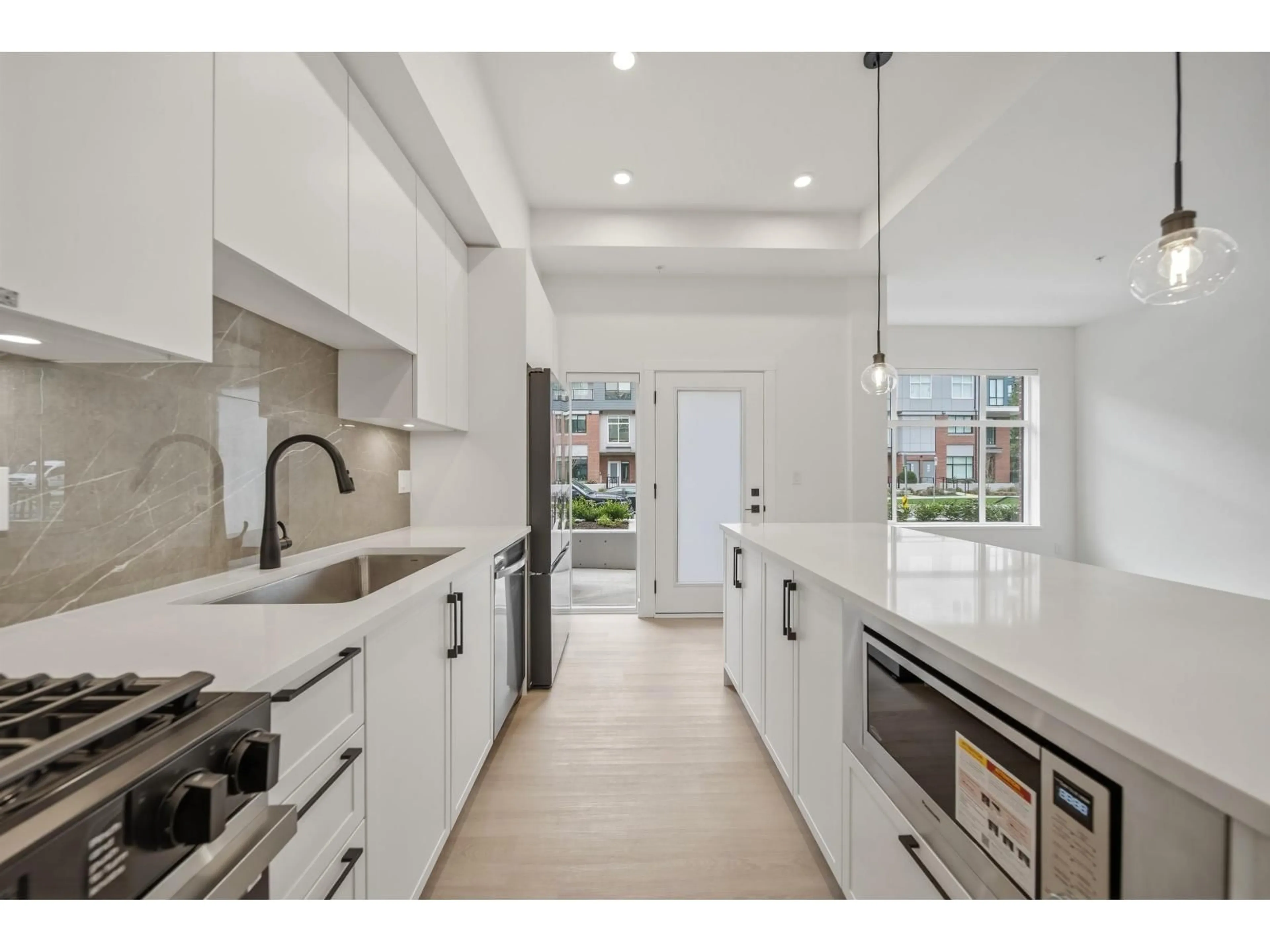 Open concept kitchen, ceramic/tile floor for 111 - 3465 146A STREET, Surrey British Columbia V0V0V0