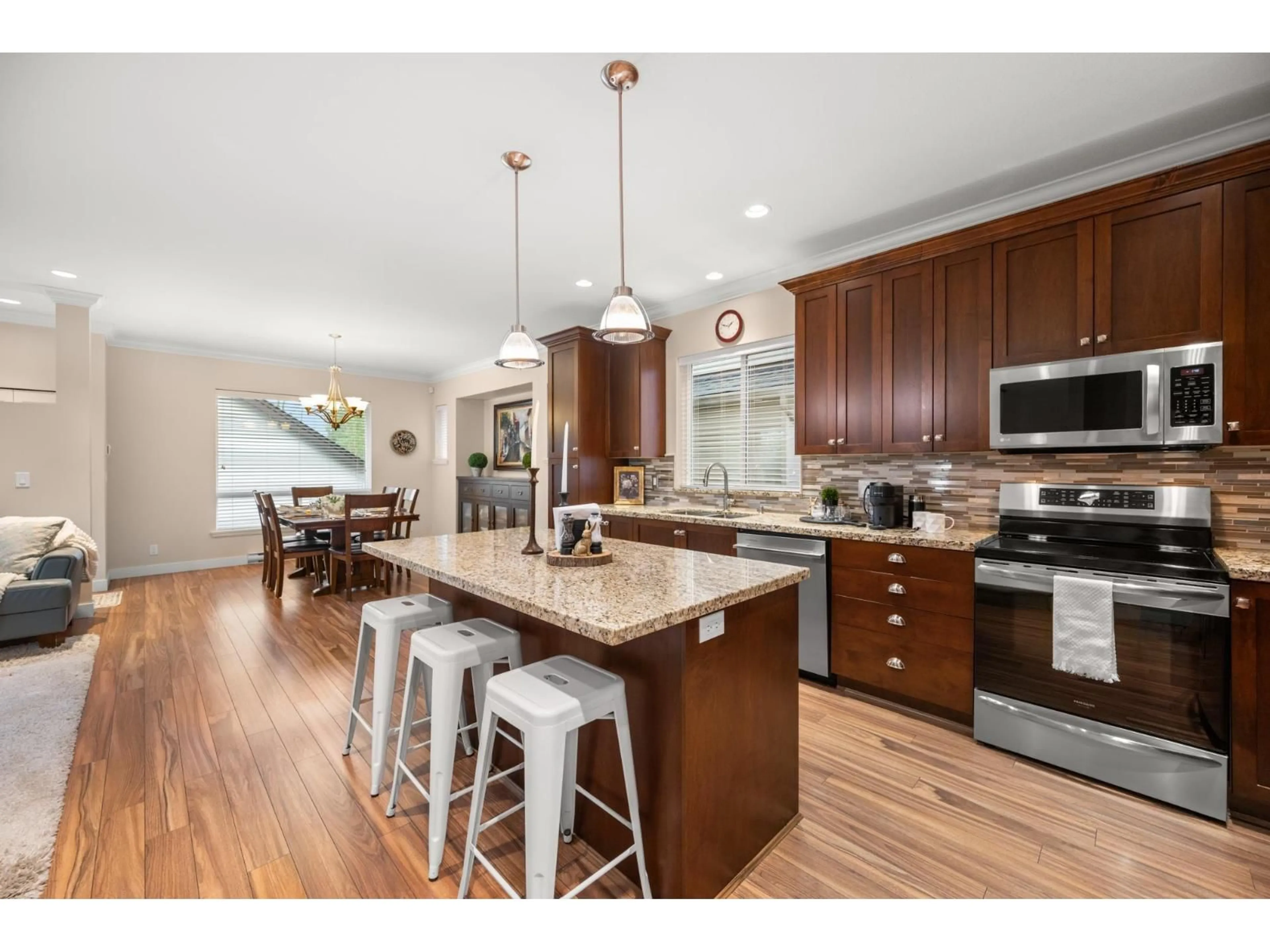 Open concept kitchen, wood/laminate floor for 18990 67A AVENUE, Surrey British Columbia V4N6A2