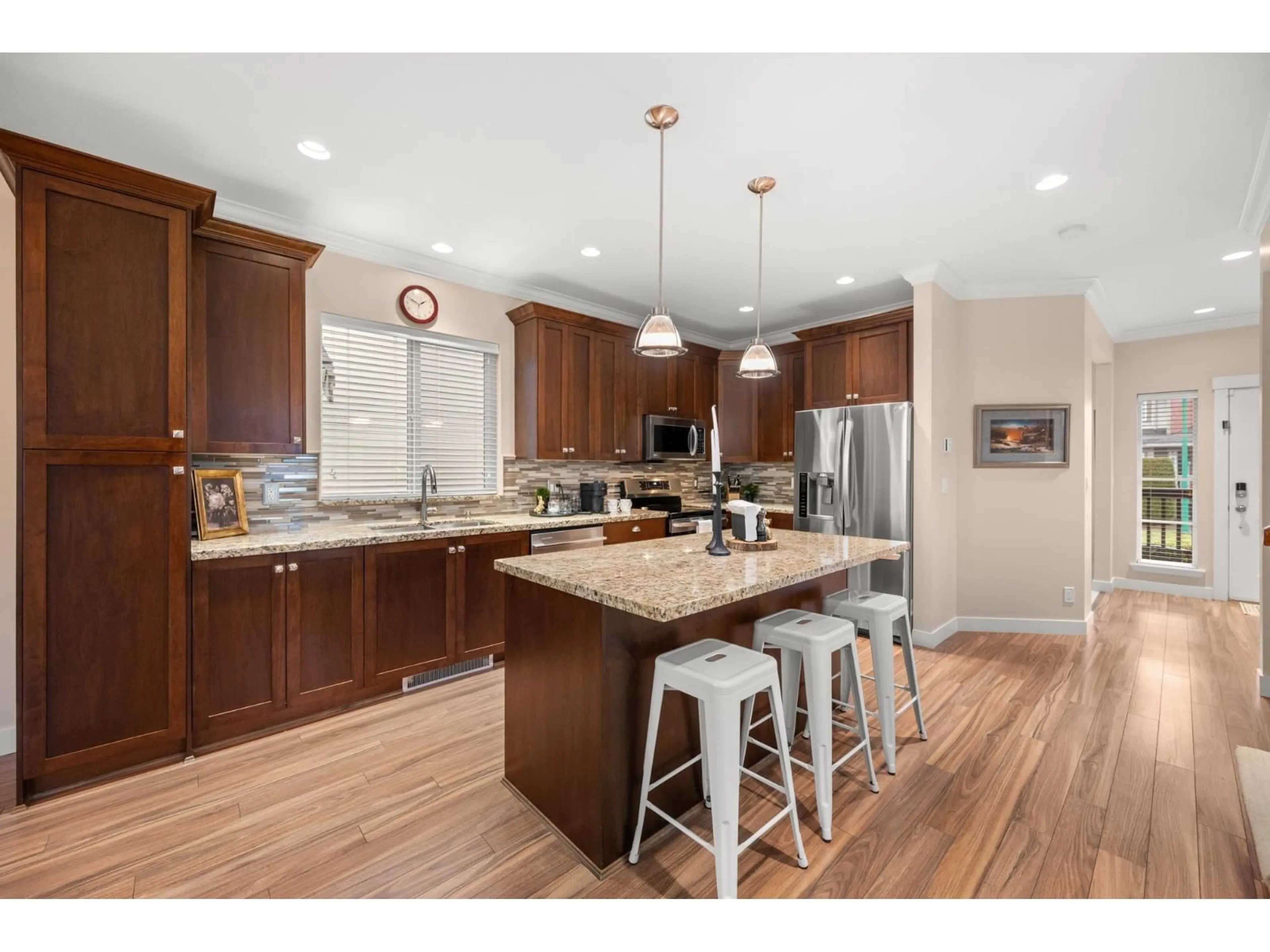 Open concept kitchen, wood/laminate floor for 18990 67A AVENUE, Surrey British Columbia V4N6A2