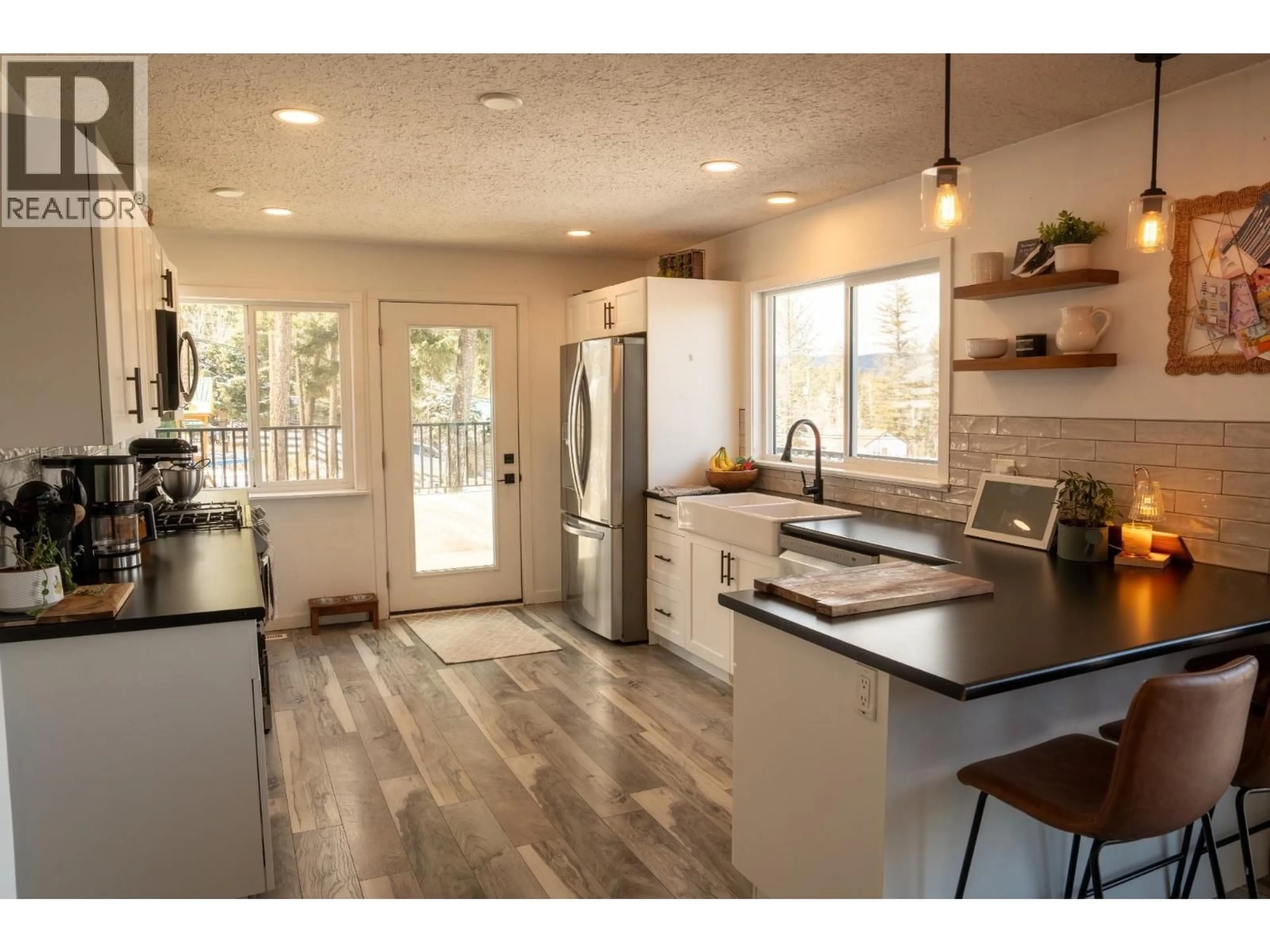 Open concept kitchen, wood/laminate floor for 804 SHAW ROAD, Williams Lake British Columbia V2G3L1