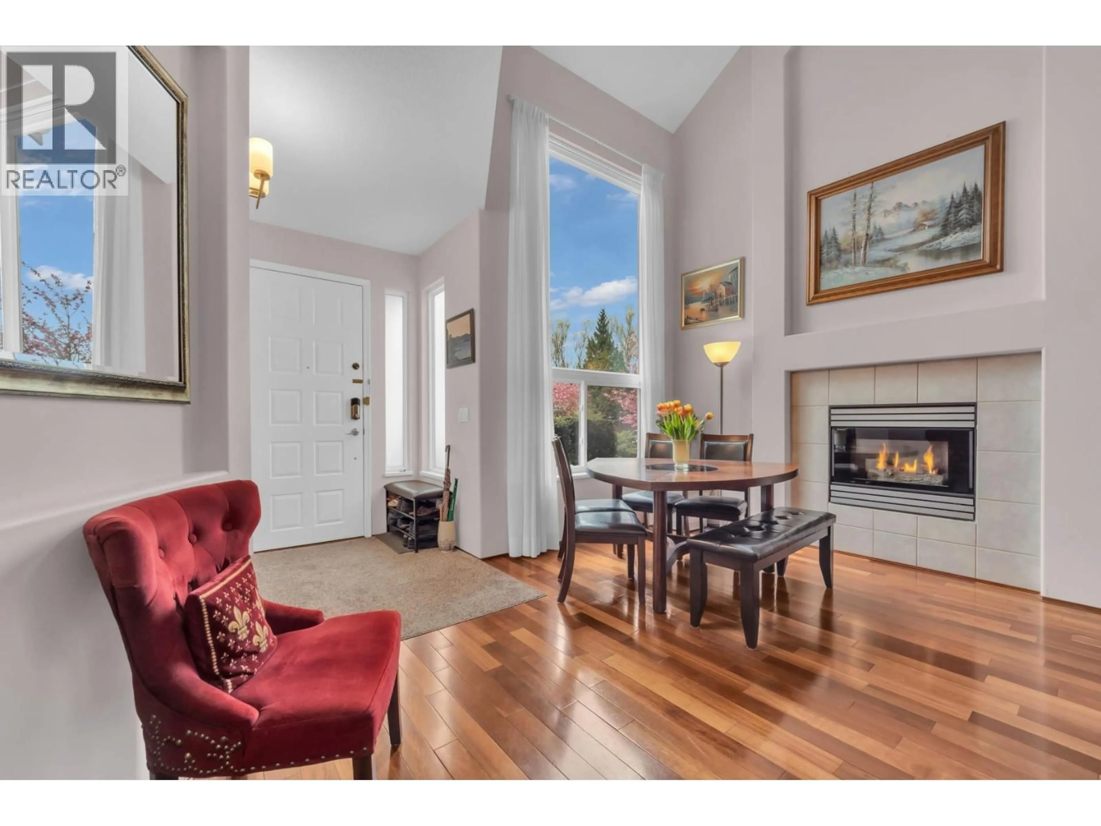 Living room with furniture, wood/laminate floor for 707 OMINECA AVENUE, Port Coquitlam British Columbia V3B7N9