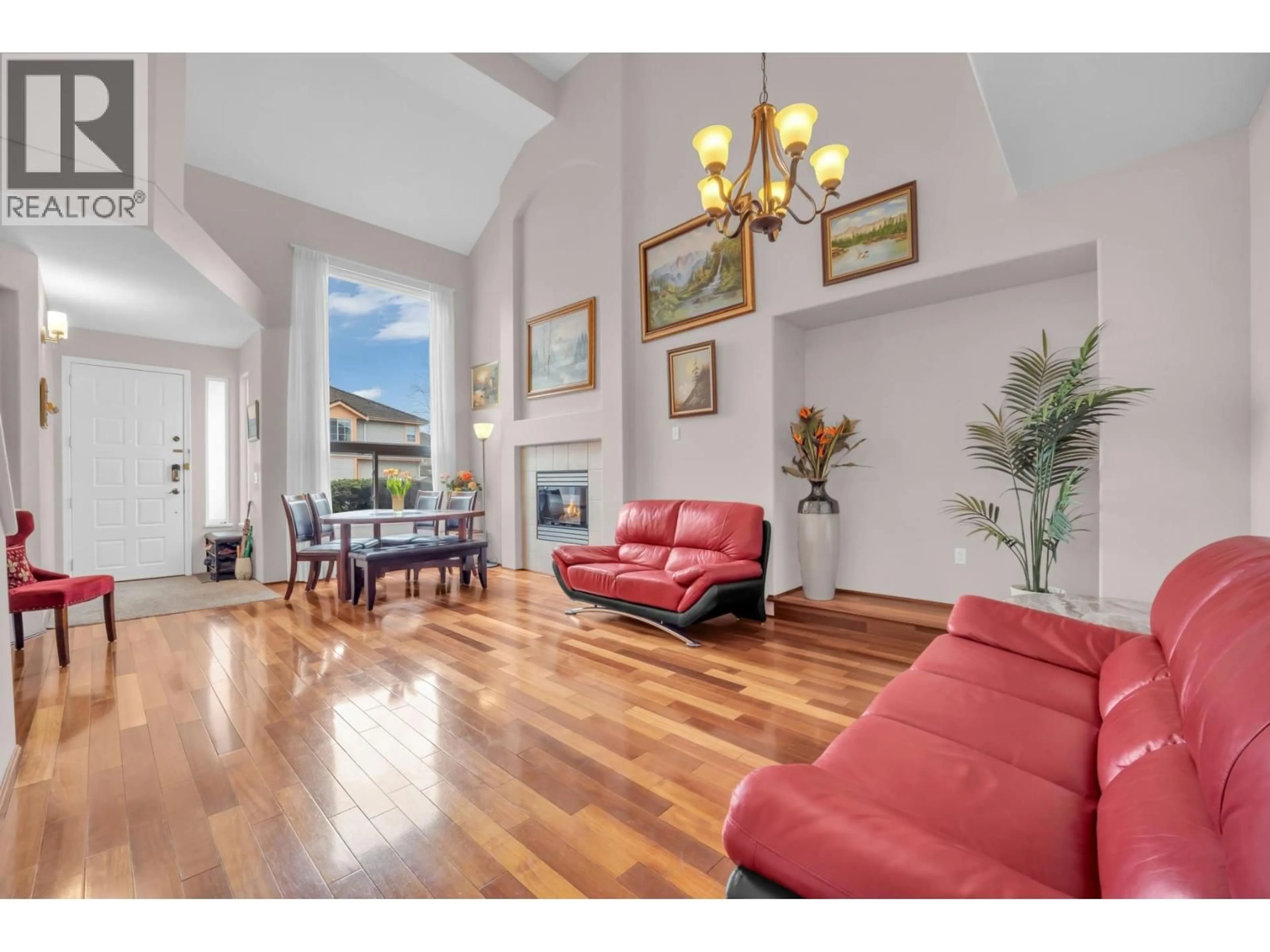 Living room with furniture, wood/laminate floor for 707 OMINECA AVENUE, Port Coquitlam British Columbia V3B7N9