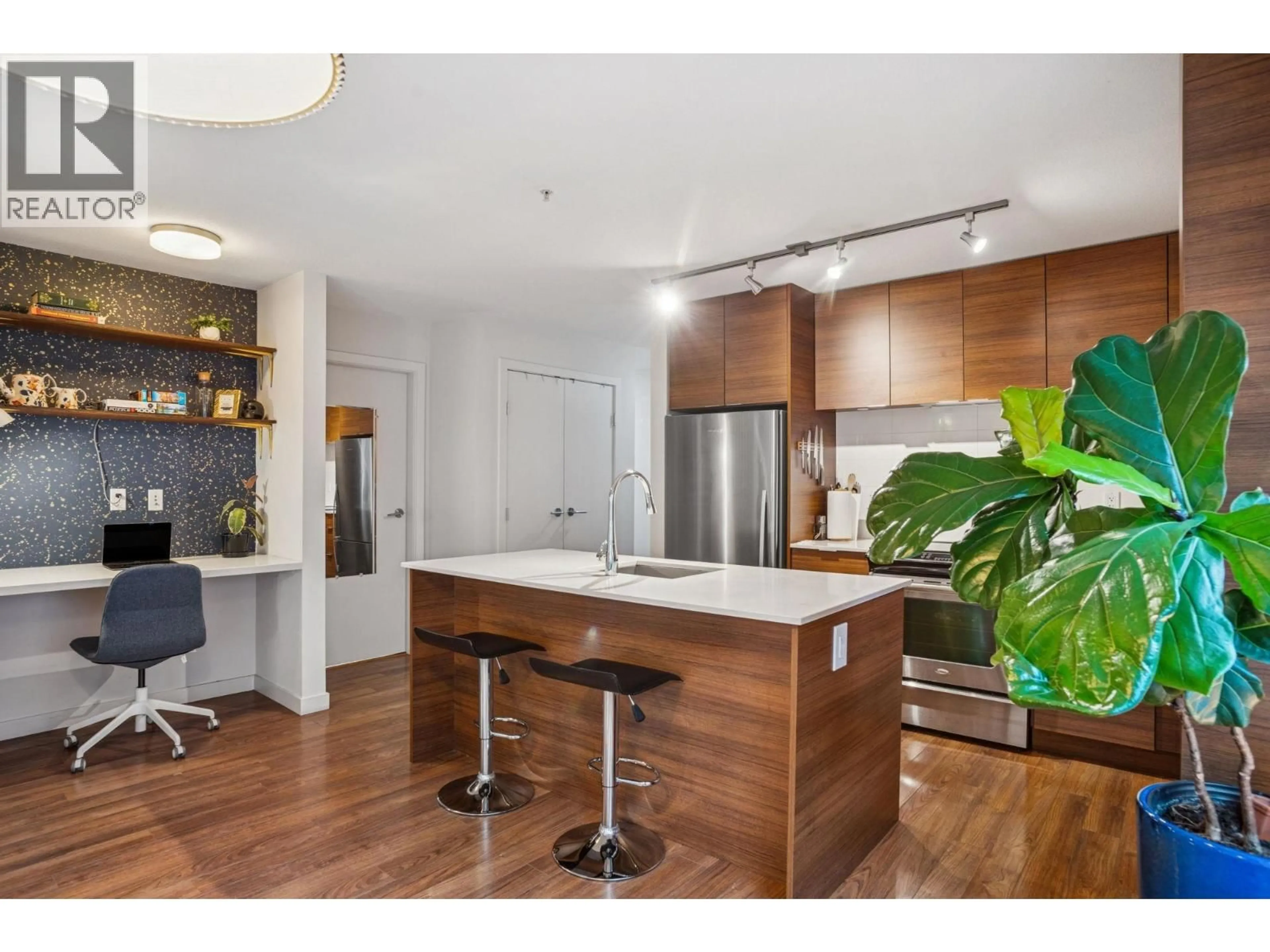 Open concept kitchen, wood/laminate floor for 310 - 1673 LLOYD AVENUE, North Vancouver British Columbia V7P0A9