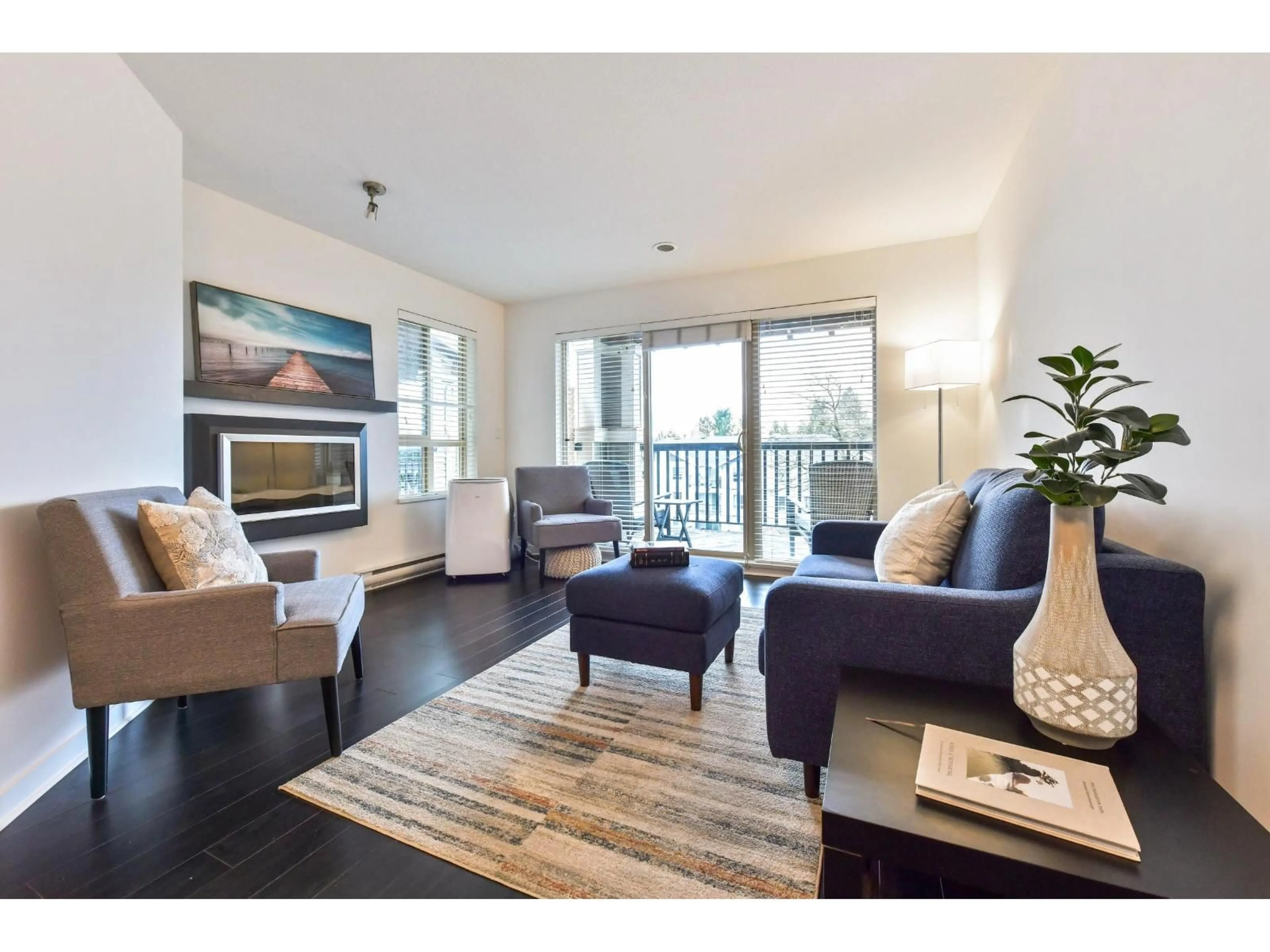 Living room with furniture, wood/laminate floor for 426 - 21009 56 AVENUE, Langley British Columbia V3A0C9