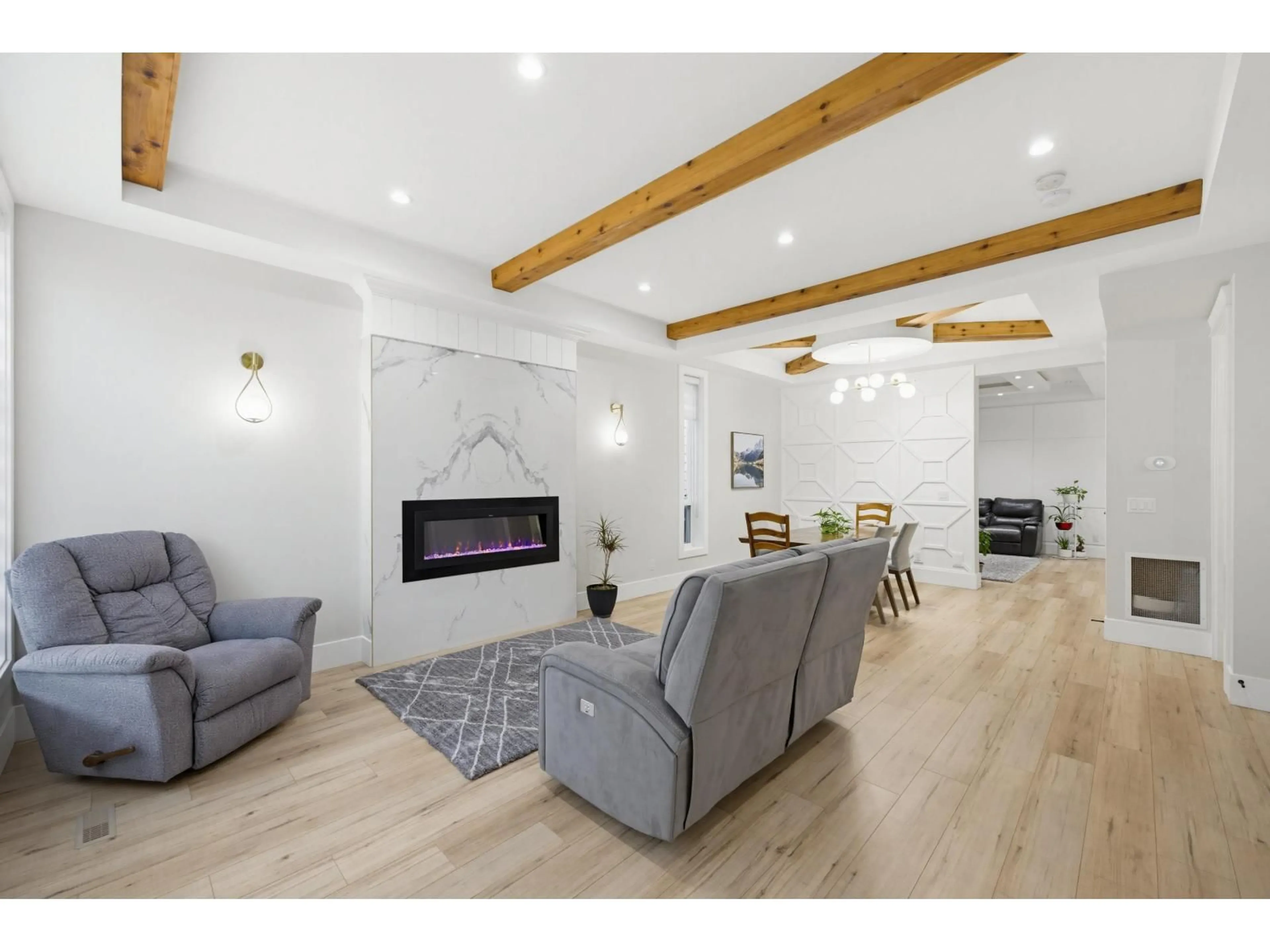 Living room with furniture, wood/laminate floor for 7115 206 STREET, Langley British Columbia V2Y3J9