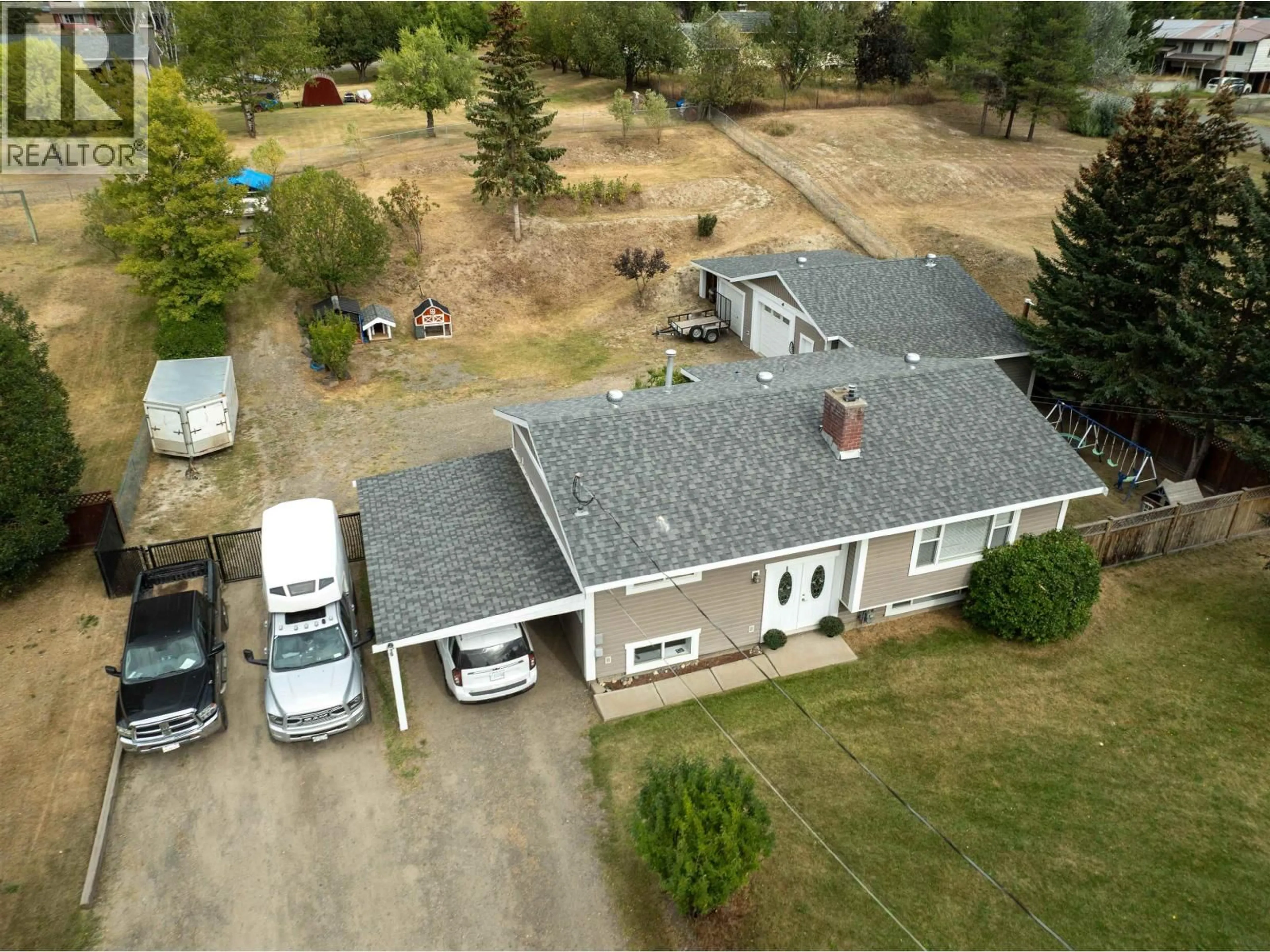 A pic from outside/outdoor area/front of a property/back of a property/a pic from drone, building for 5665 HORSE LAKE ROAD, 100 Mile House British Columbia V0K2E1