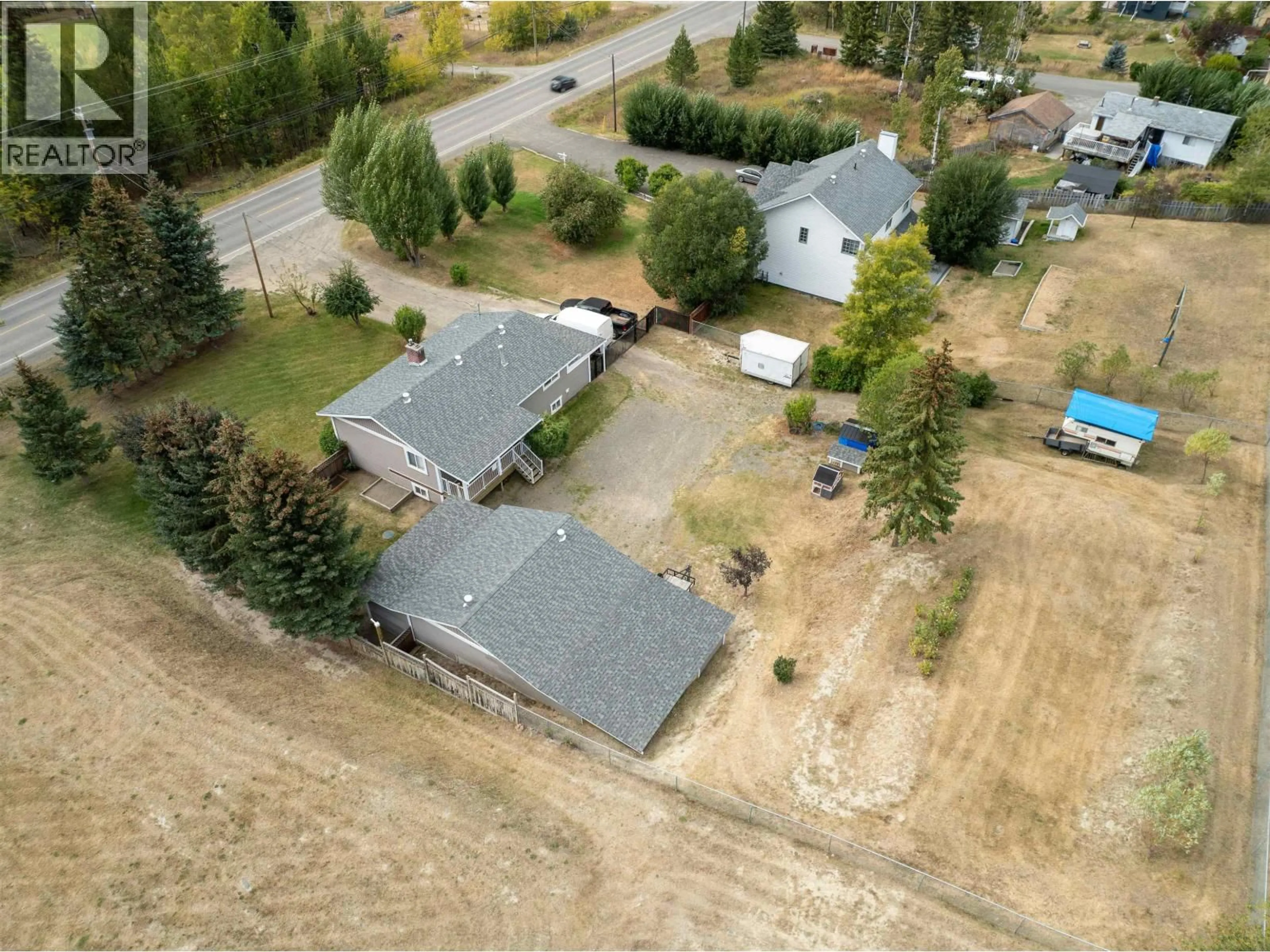 A pic from outside/outdoor area/front of a property/back of a property/a pic from drone, street for 5665 HORSE LAKE ROAD, 100 Mile House British Columbia V0K2E1