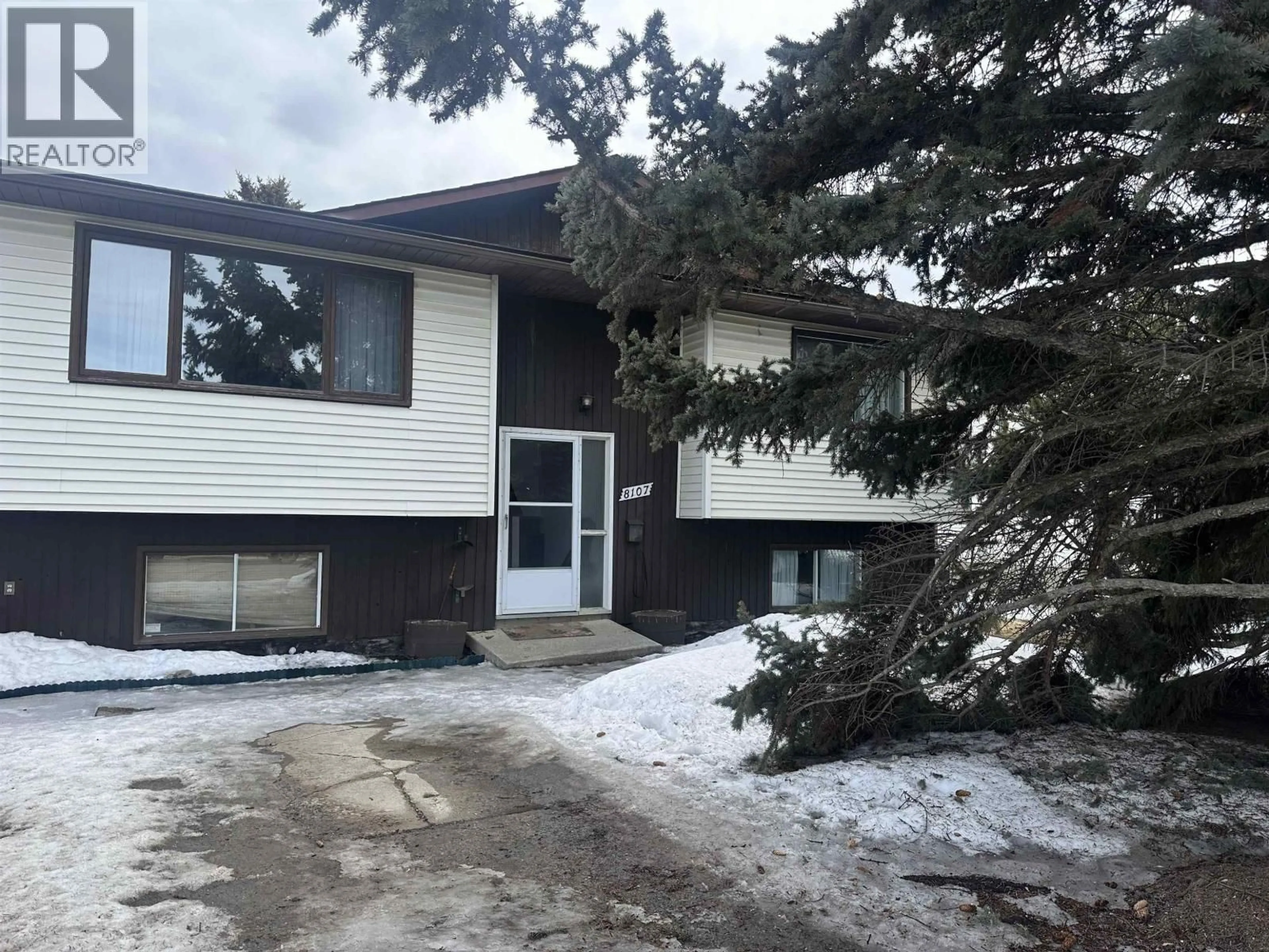 Home with vinyl exterior material, street for 8107 97 AVENUE, Fort St. John British Columbia V1J1L8