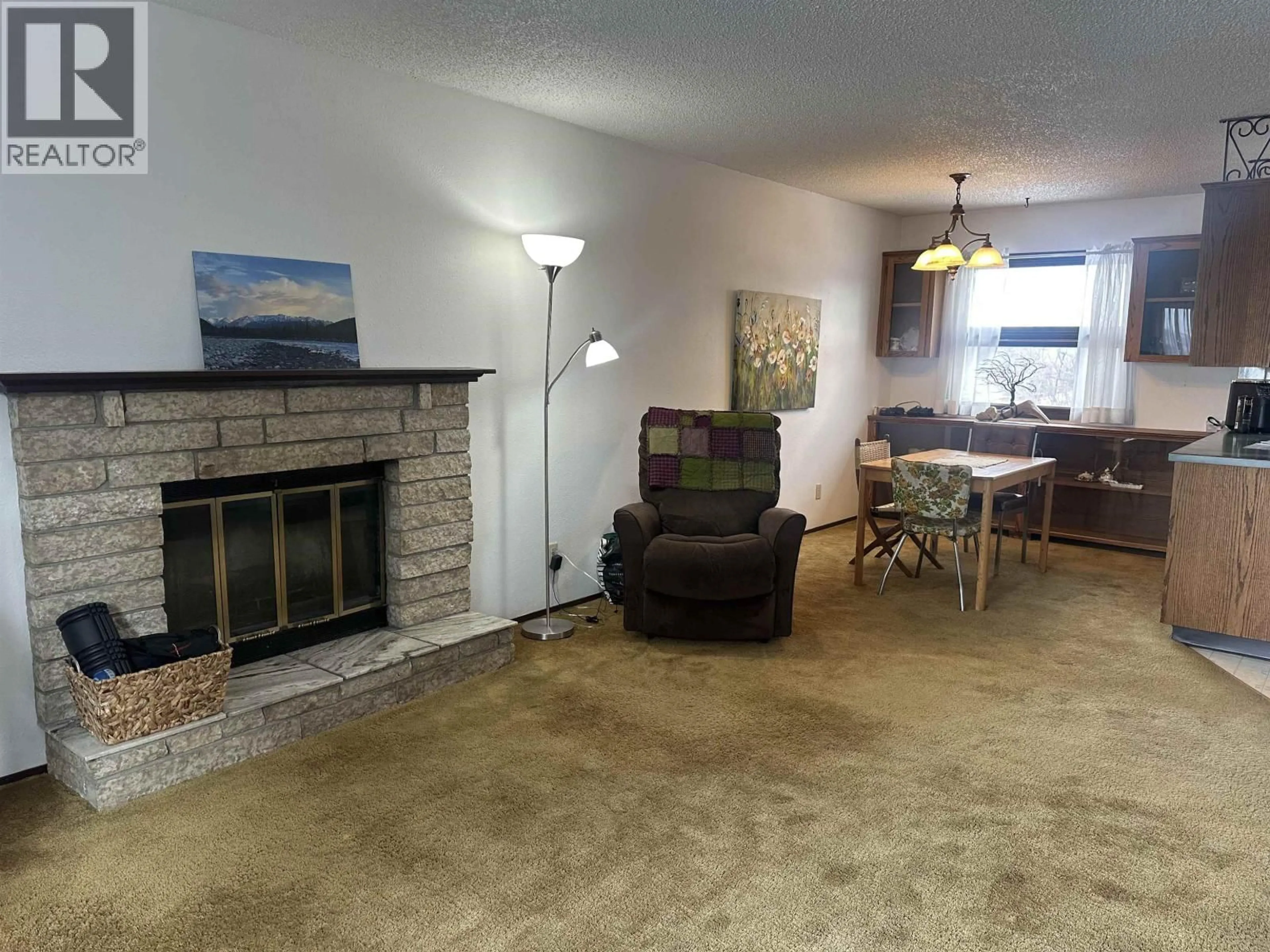 Living room with furniture, unknown for 8107 97 AVENUE, Fort St. John British Columbia V1J1L8