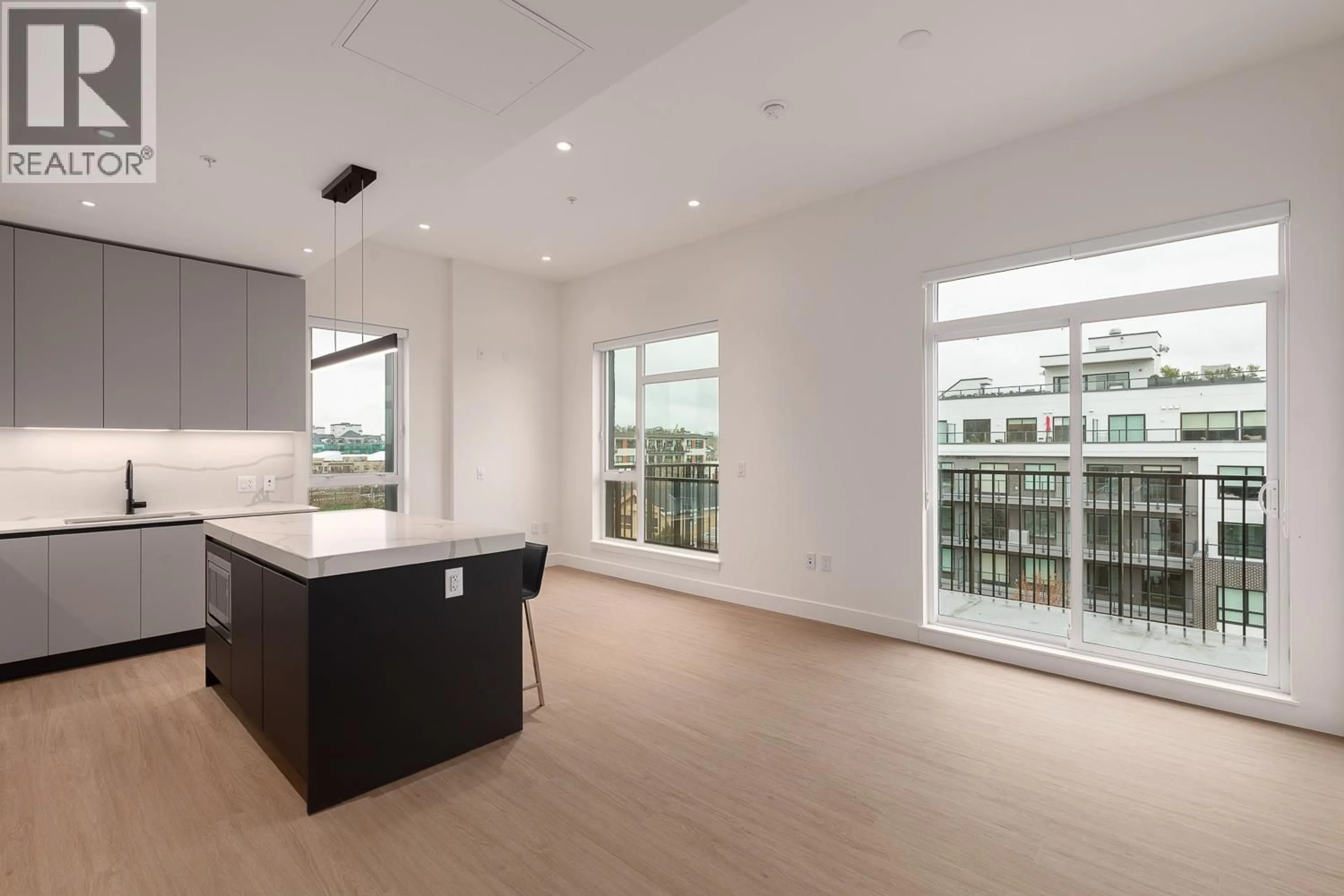 Open concept kitchen, wood/laminate floor for 602 - 2235 BROADWAY, Vancouver British Columbia V5N0J5
