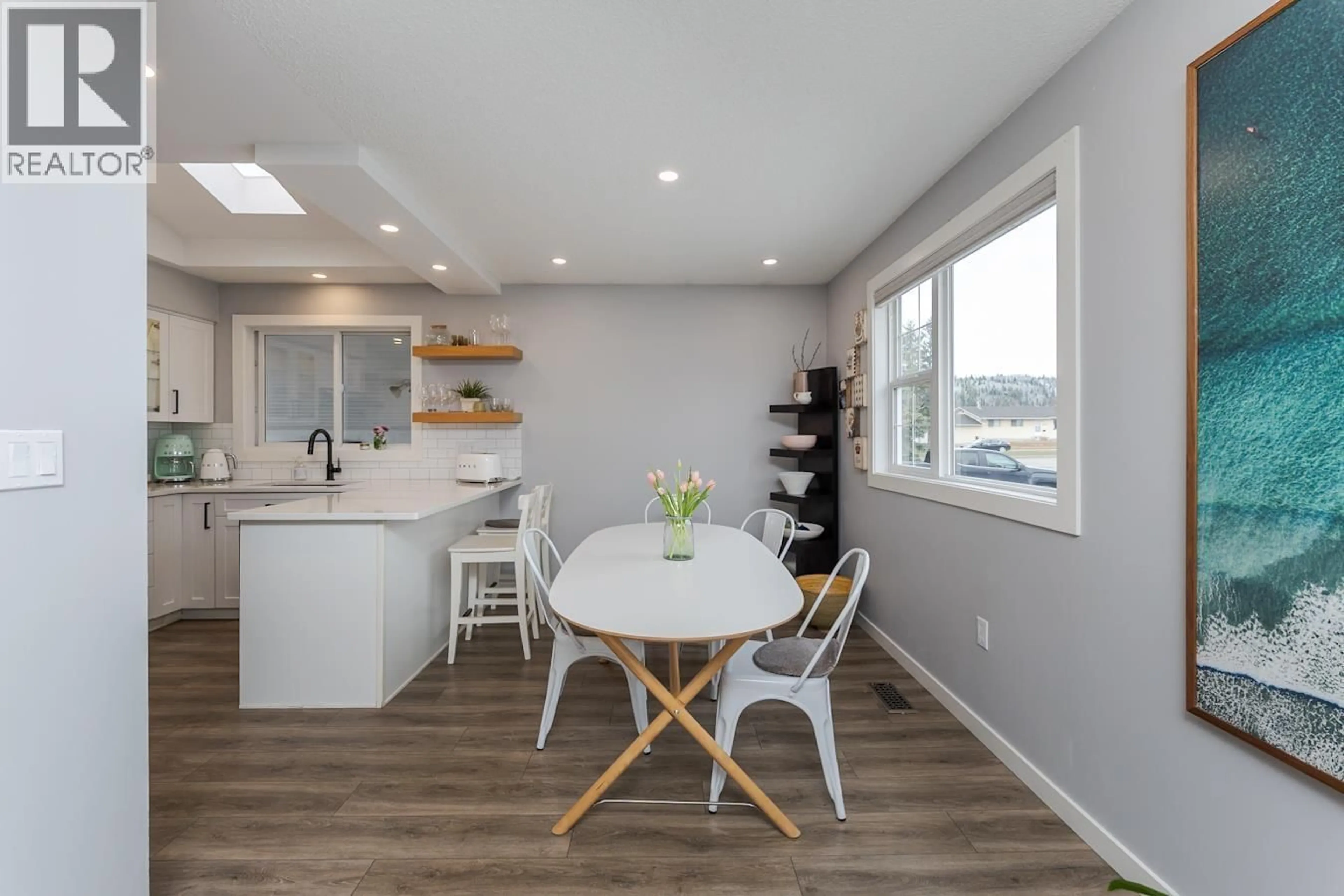 Open concept kitchen, wood/laminate floor for 1011 HANSARD CRESCENT, Prince George British Columbia V2M4J8