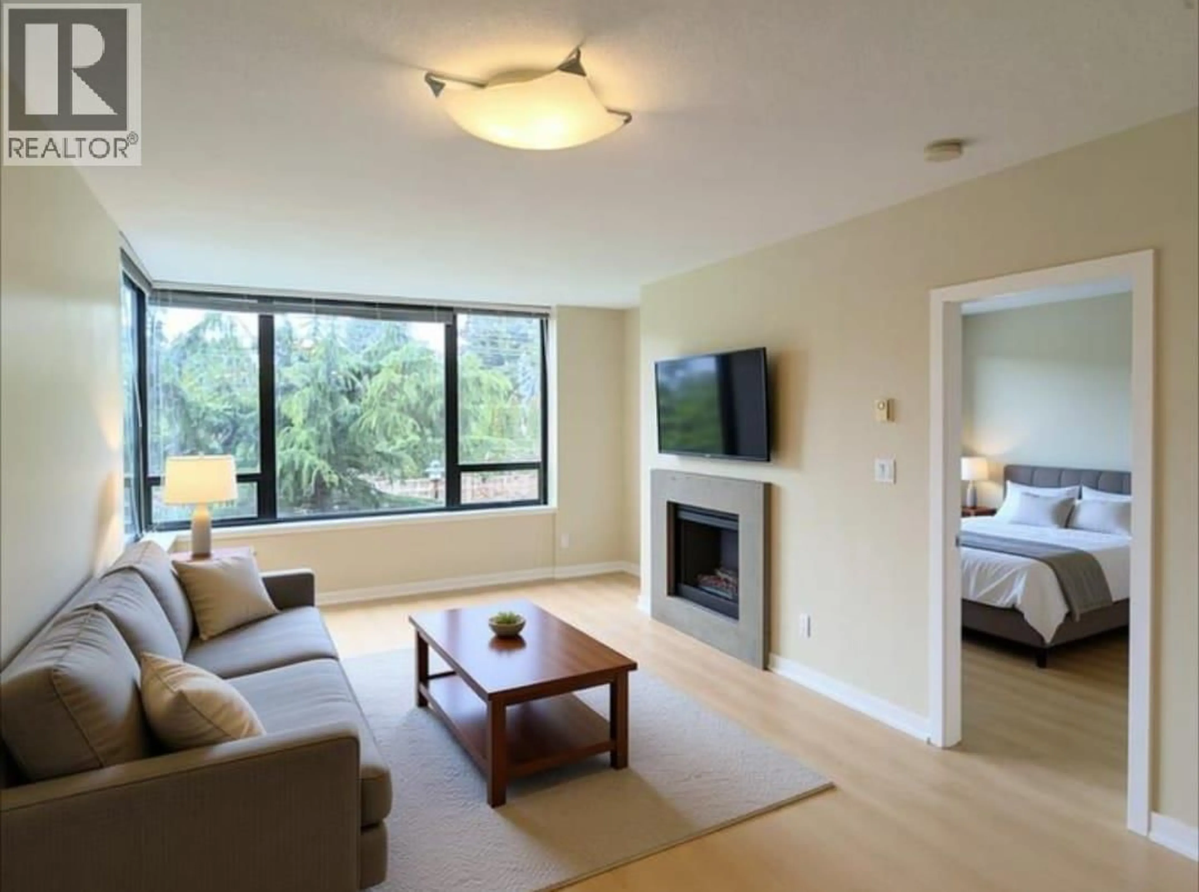 Living room with furniture, wood/laminate floor for 306 - 9188 HEMLOCK DRIVE, Richmond British Columbia V6Y4J7