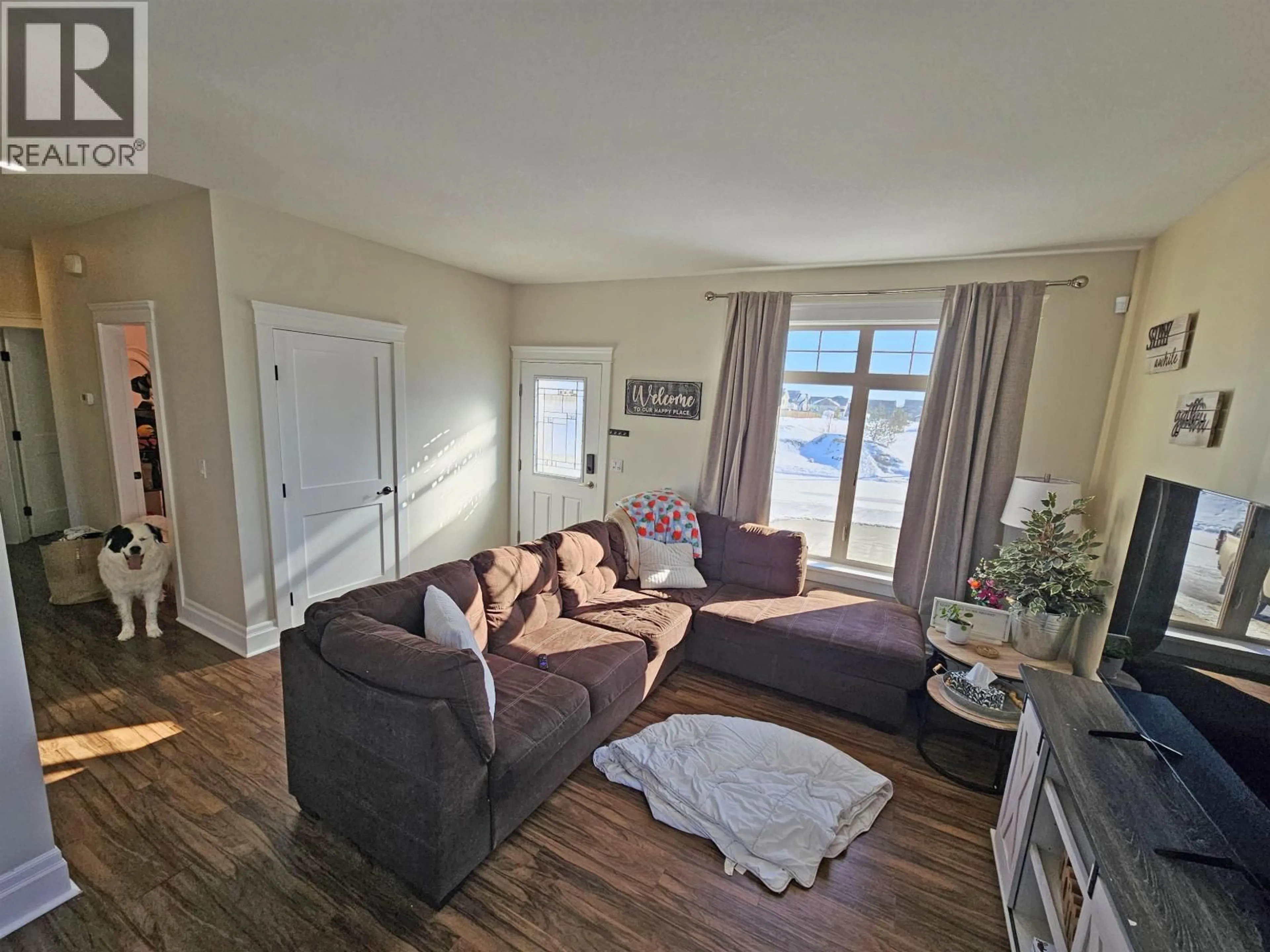 Living room with furniture, wood/laminate floor for 8616 84 STREET, Fort St. John British Columbia V1J0K8