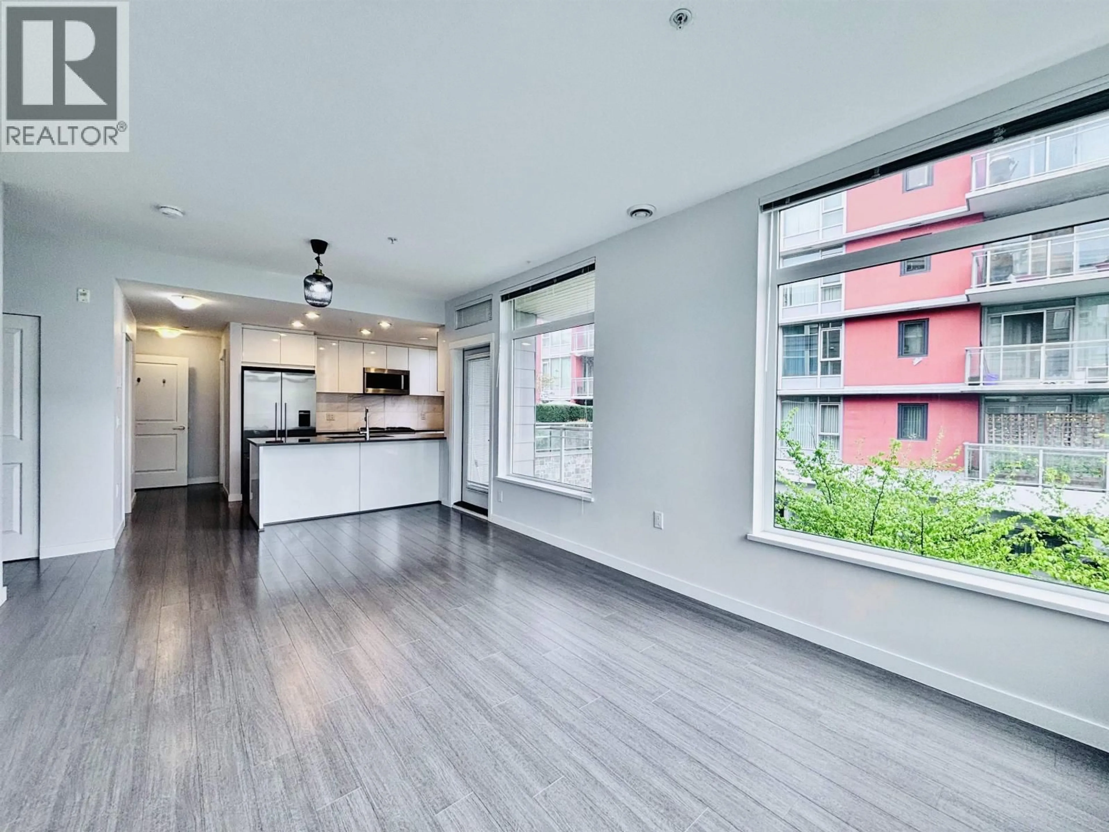 Open concept kitchen, wood/laminate floor for 302 - 3263 PIERVIEW CRESCENT, Vancouver British Columbia V5S0C3