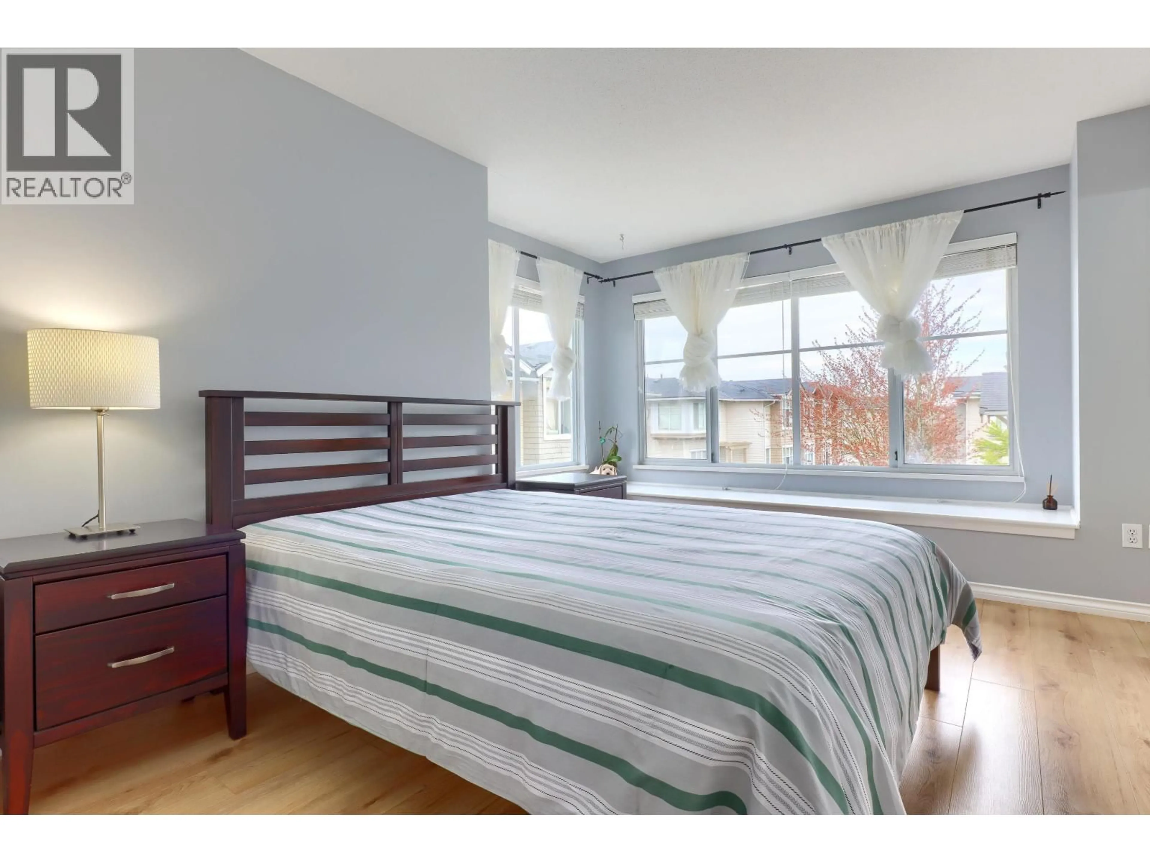 Bedroom with bed, wood/laminate floor for 29 - 6588 BARNARD DRIVE, Richmond British Columbia V7C5R8