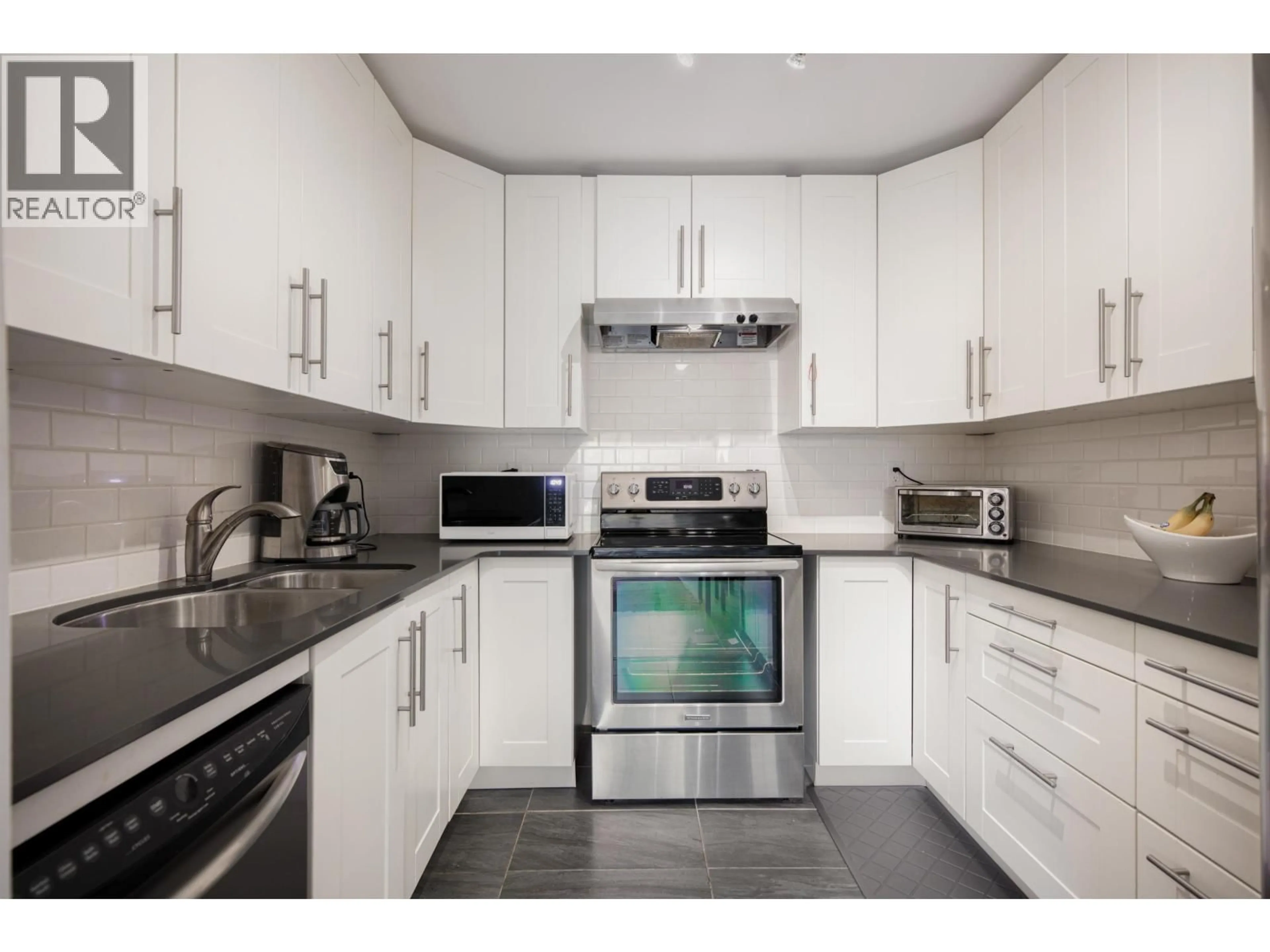 Standard kitchen, wood/laminate floor for 215 - 251 4TH STREET, North Vancouver British Columbia V7M1H8