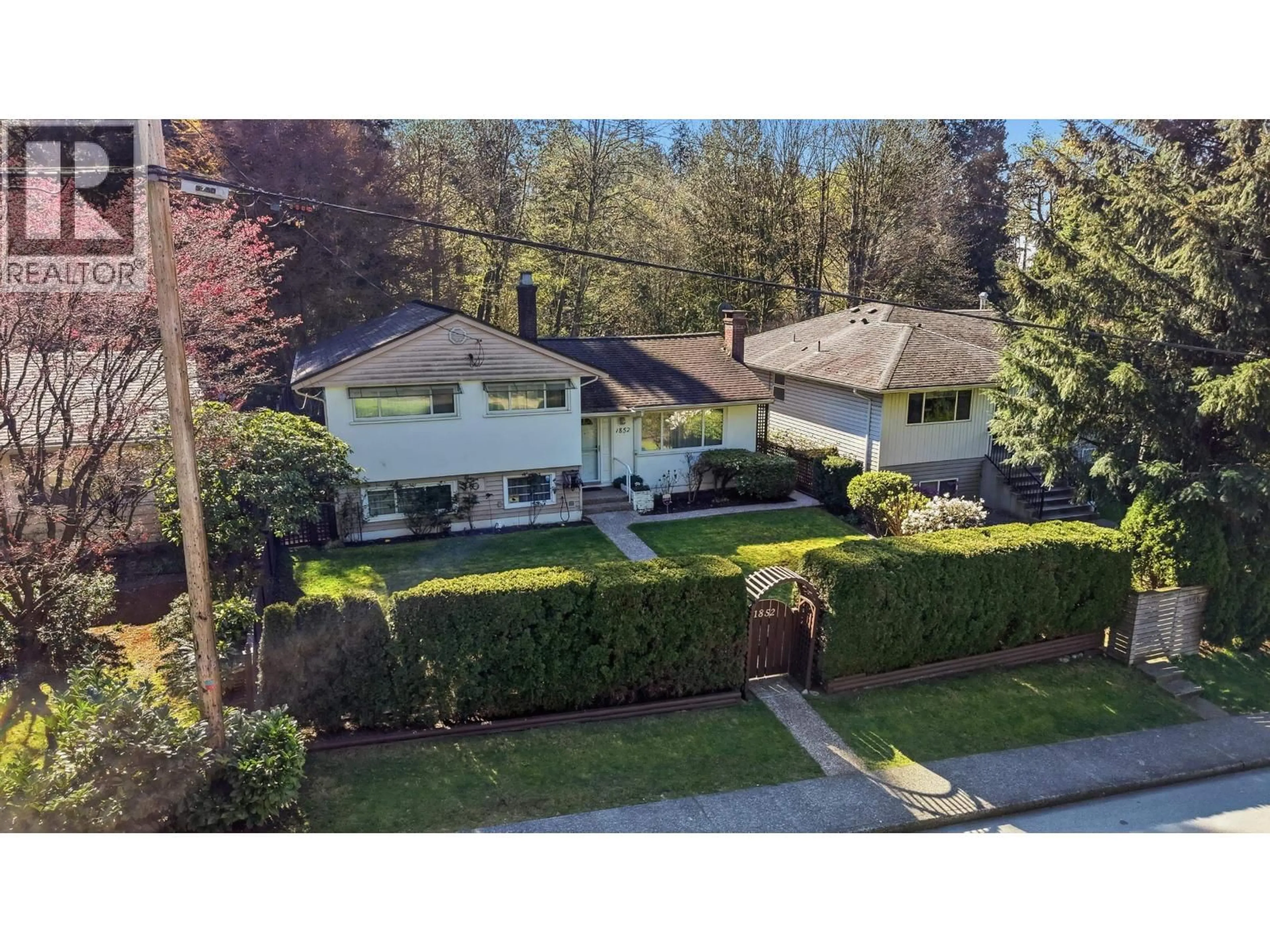 A pic from outside/outdoor area/front of a property/back of a property/a pic from drone, street for 1852 LARSON ROAD, North Vancouver British Columbia V7M2Z6
