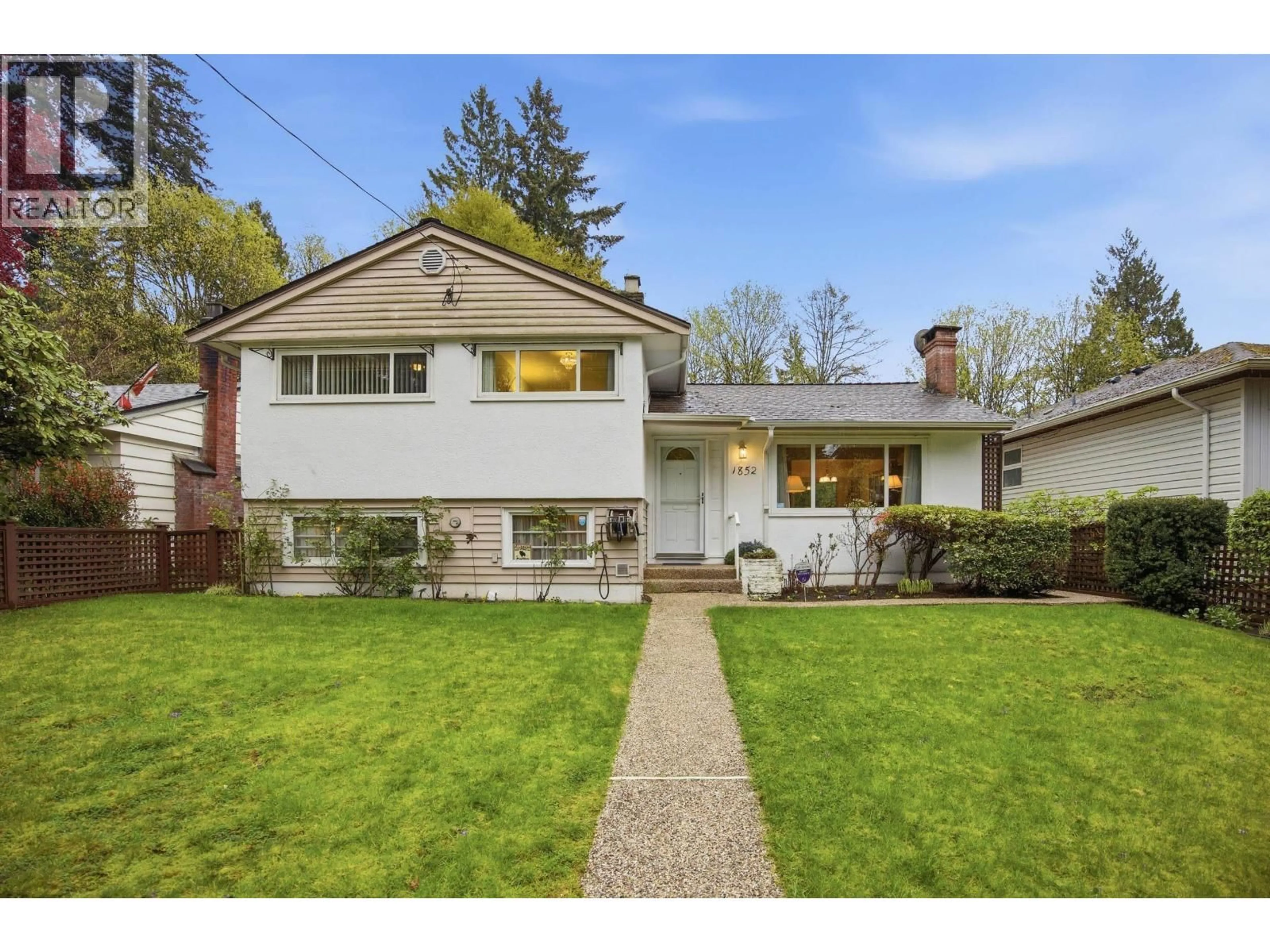 Home with vinyl exterior material, street for 1852 LARSON ROAD, North Vancouver British Columbia V7M2Z6