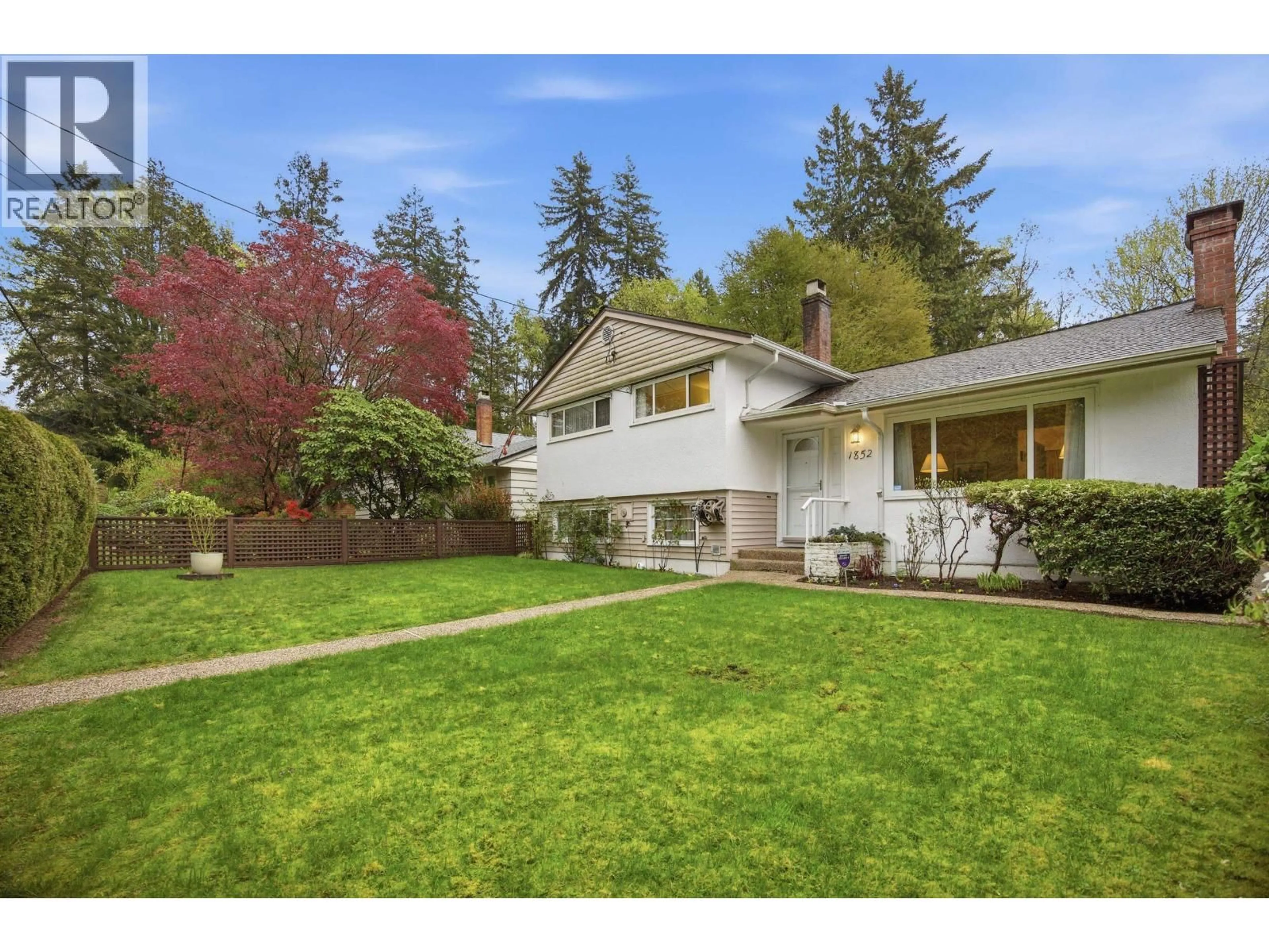 Home with vinyl exterior material, street for 1852 LARSON ROAD, North Vancouver British Columbia V7M2Z6