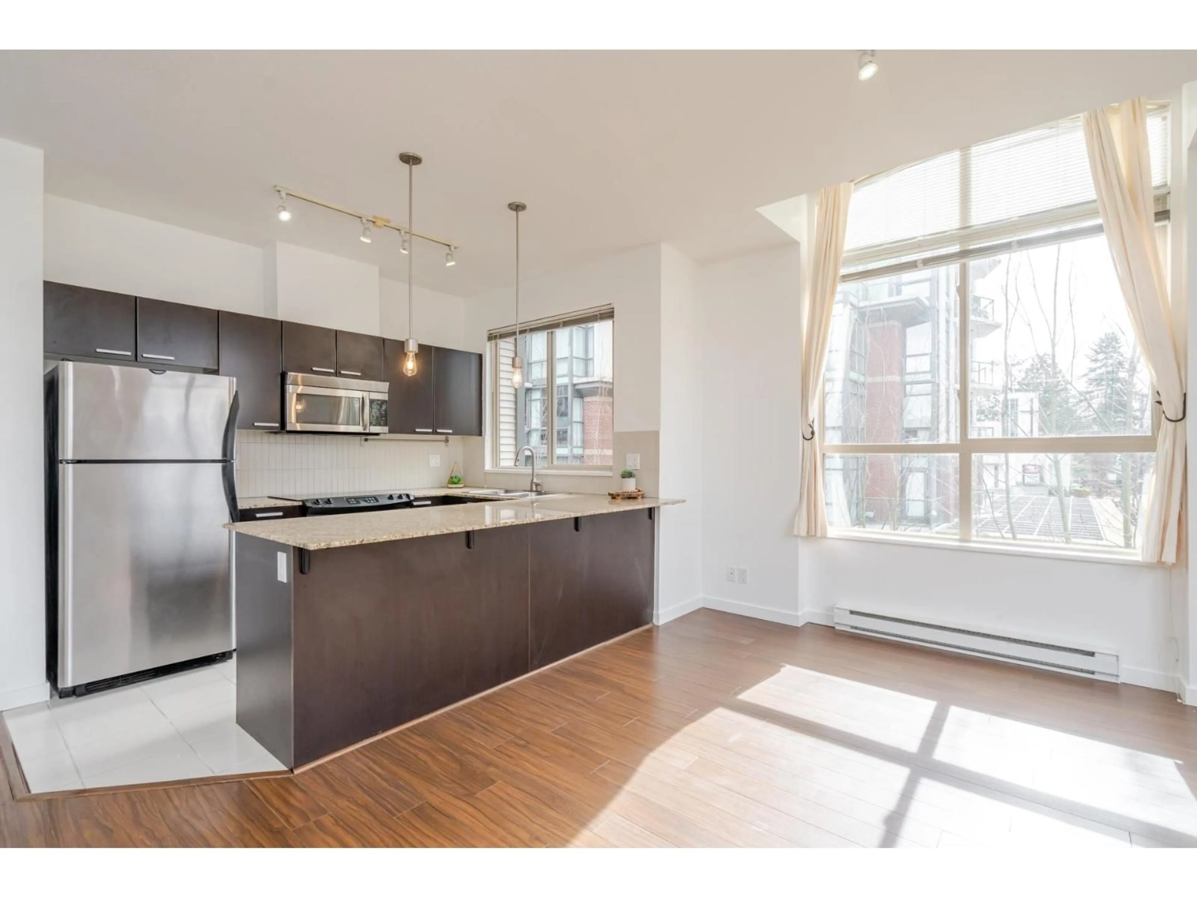 Open concept kitchen, unknown for 405 - 10455 UNIVERSITY DRIVE, Surrey British Columbia V3T0A5
