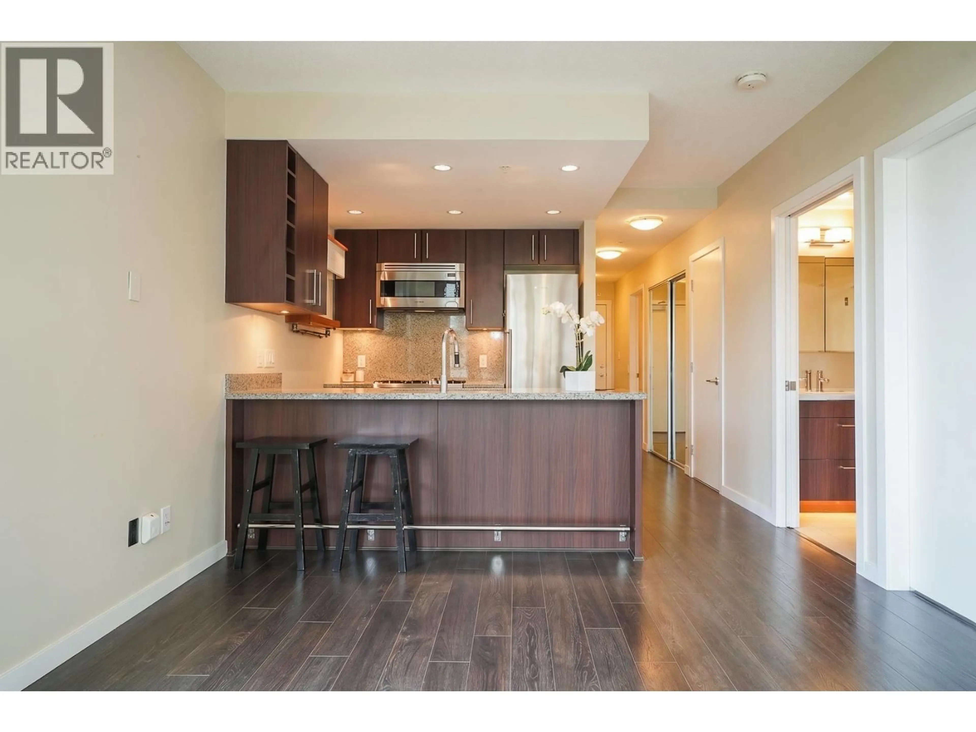 Open concept kitchen, wood/laminate floor for 707 - 108 1ST AVENUE, Vancouver British Columbia V5Y0H4