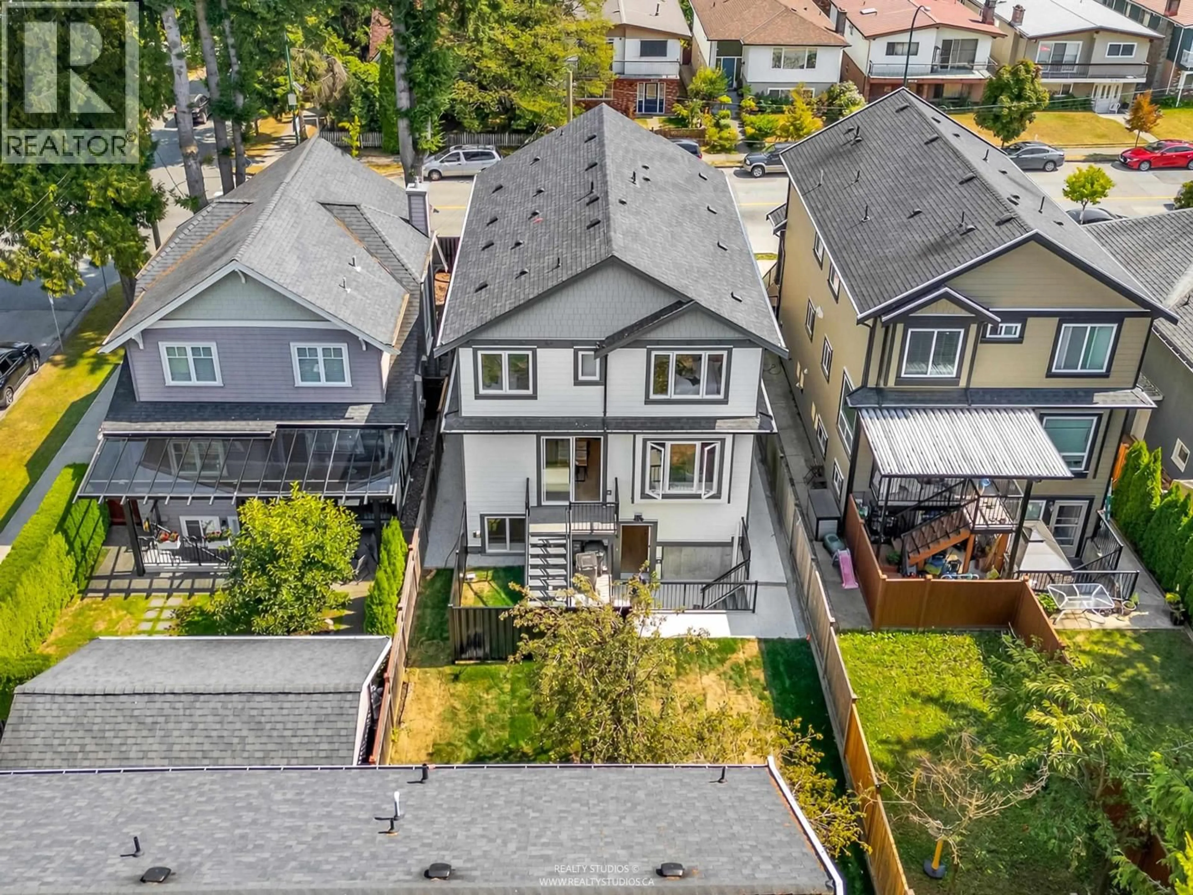 A pic from outside/outdoor area/front of a property/back of a property/a pic from drone, street for 2 - 5221 CLARENDON STREET, Vancouver British Columbia V5R3J7