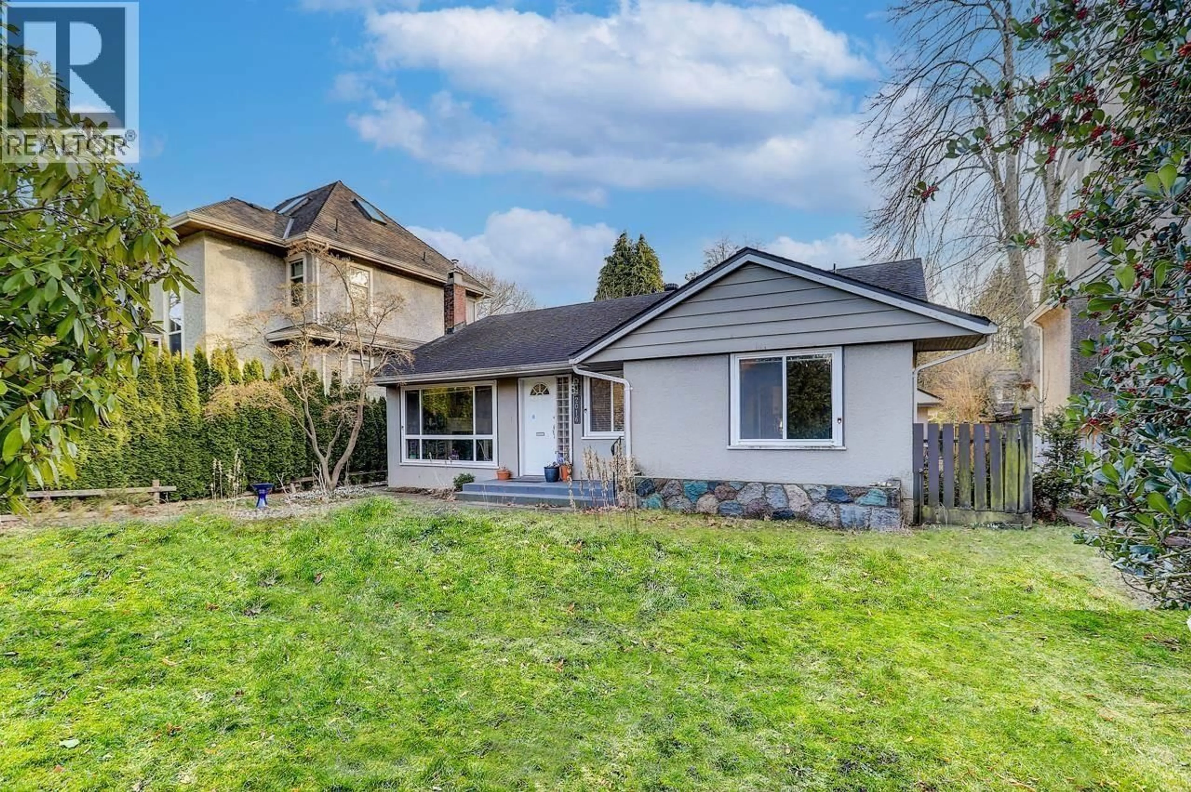 Home with vinyl exterior material, street for 2016 48TH AVENUE, Vancouver British Columbia V6M2P3