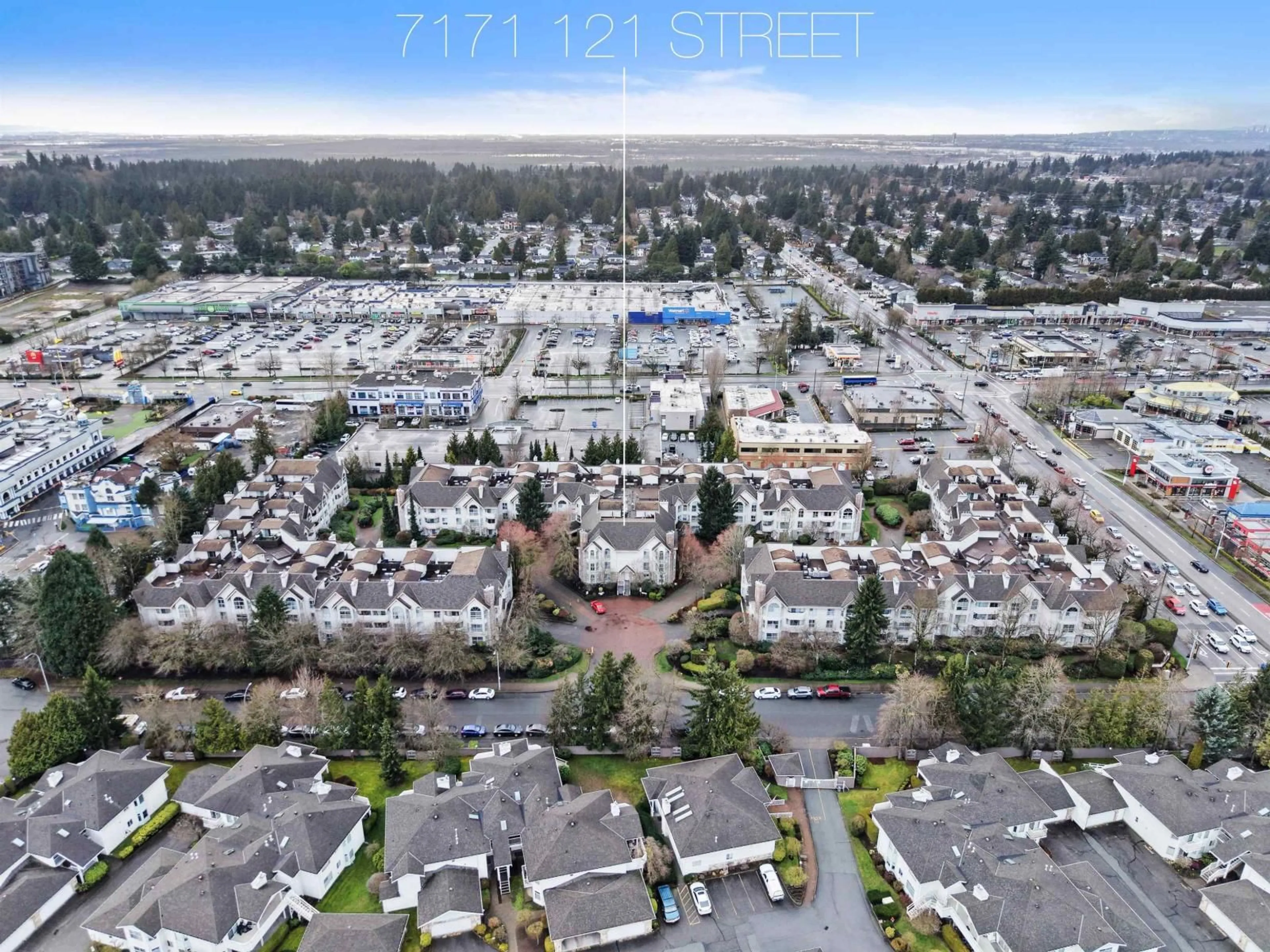 A pic from outside/outdoor area/front of a property/back of a property/a pic from drone, street for 111 - 7171 121ST STREET, Surrey British Columbia V3W1G9