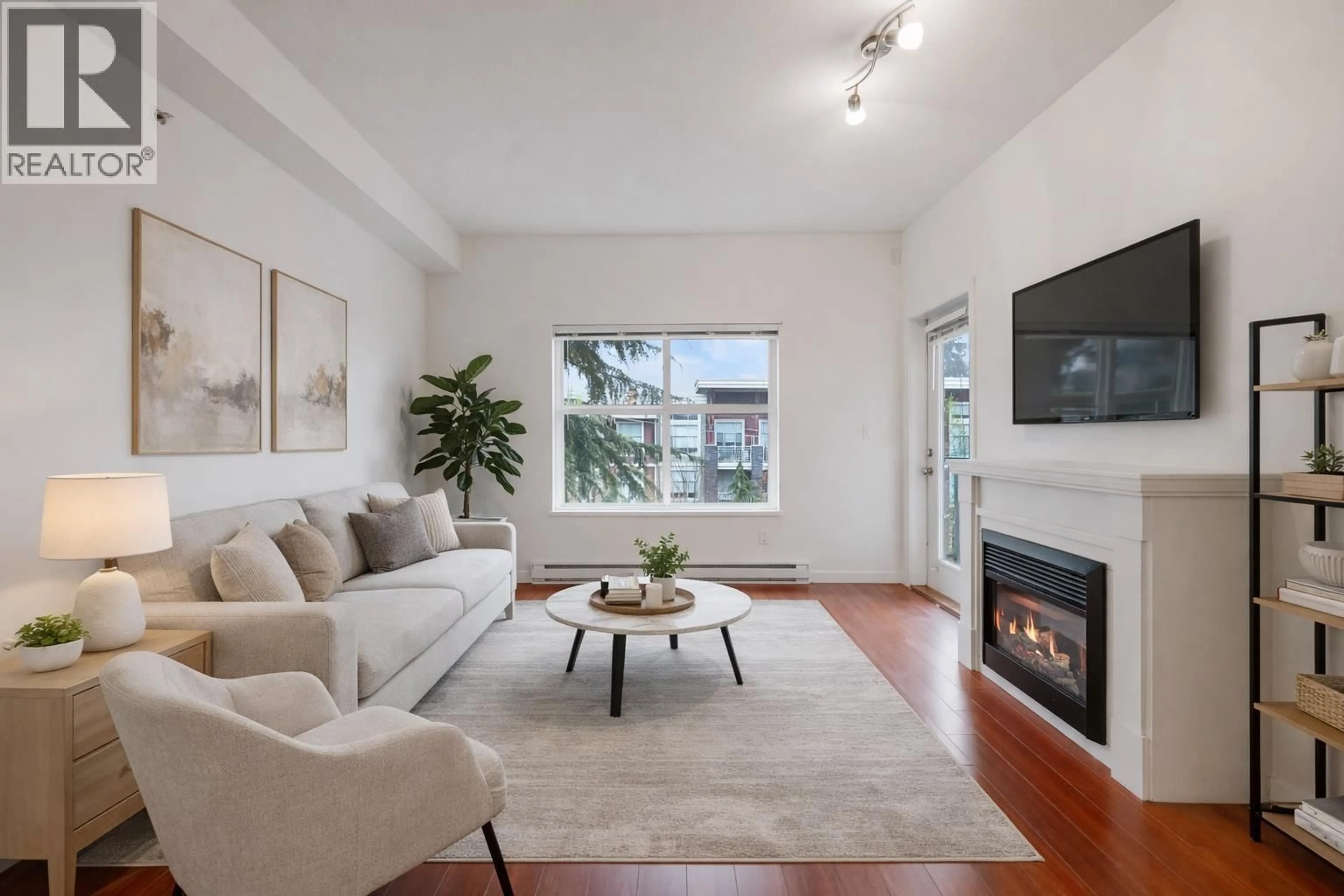 Living room with furniture, wood/laminate floor for 403 - 2488 KELLY AVENUE, Port Coquitlam British Columbia V3C1Y4