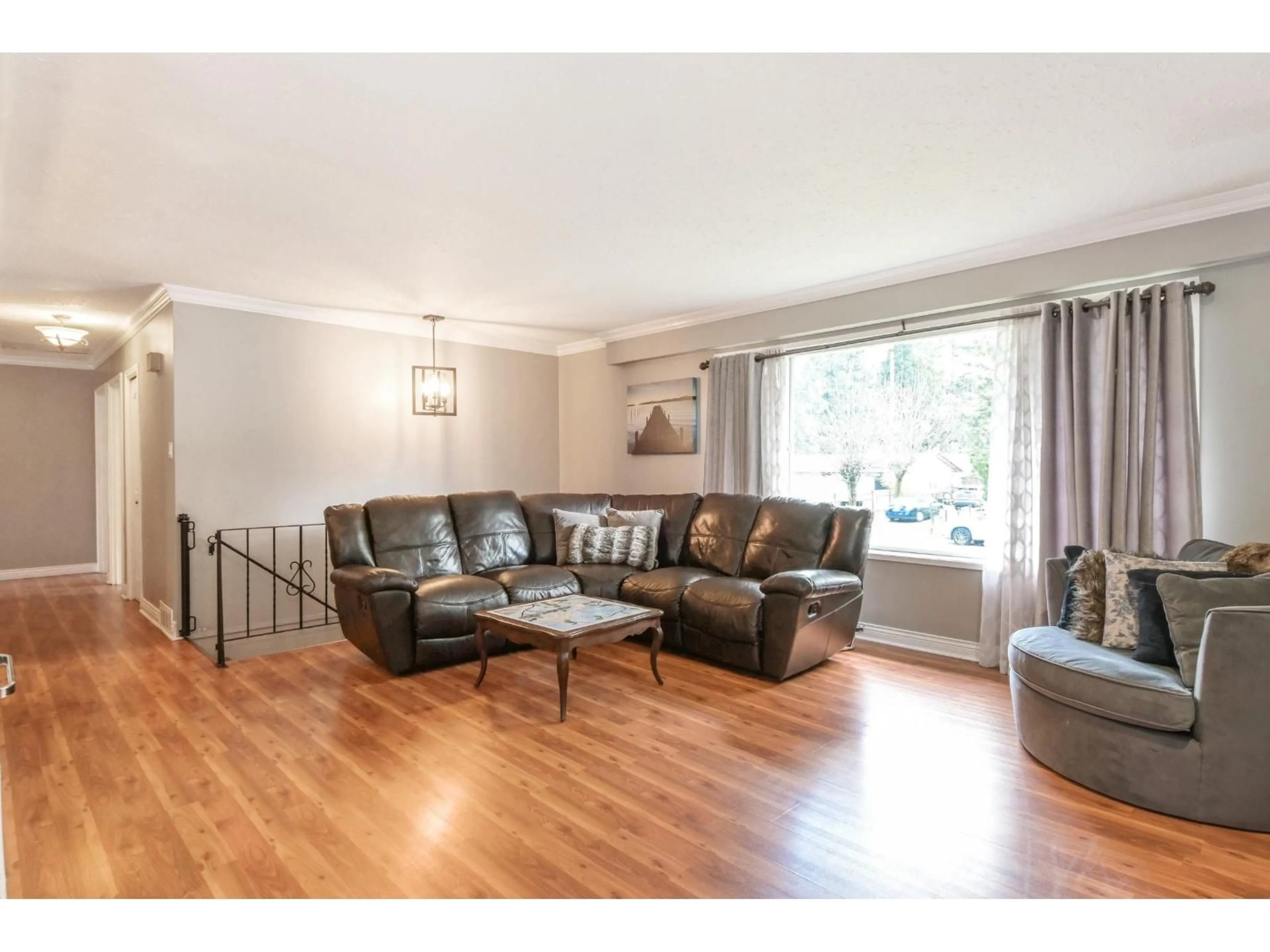 Living room with furniture, wood/laminate floor for 4551 197A STREET, Langley British Columbia V3A1C5