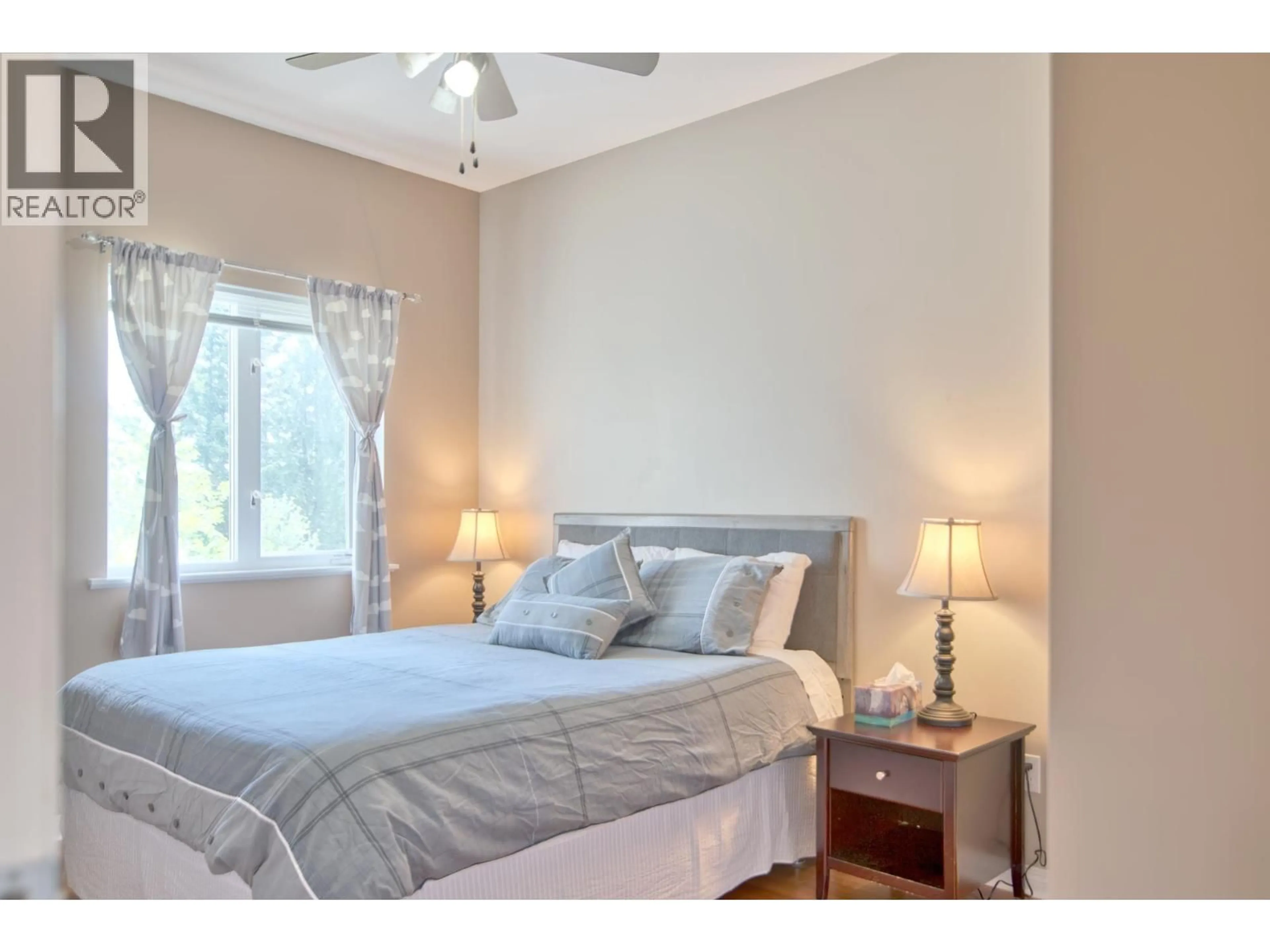 Bedroom with bed, wood/laminate floor for 6169 MIKA ROAD, Sechelt British Columbia V0N3A7