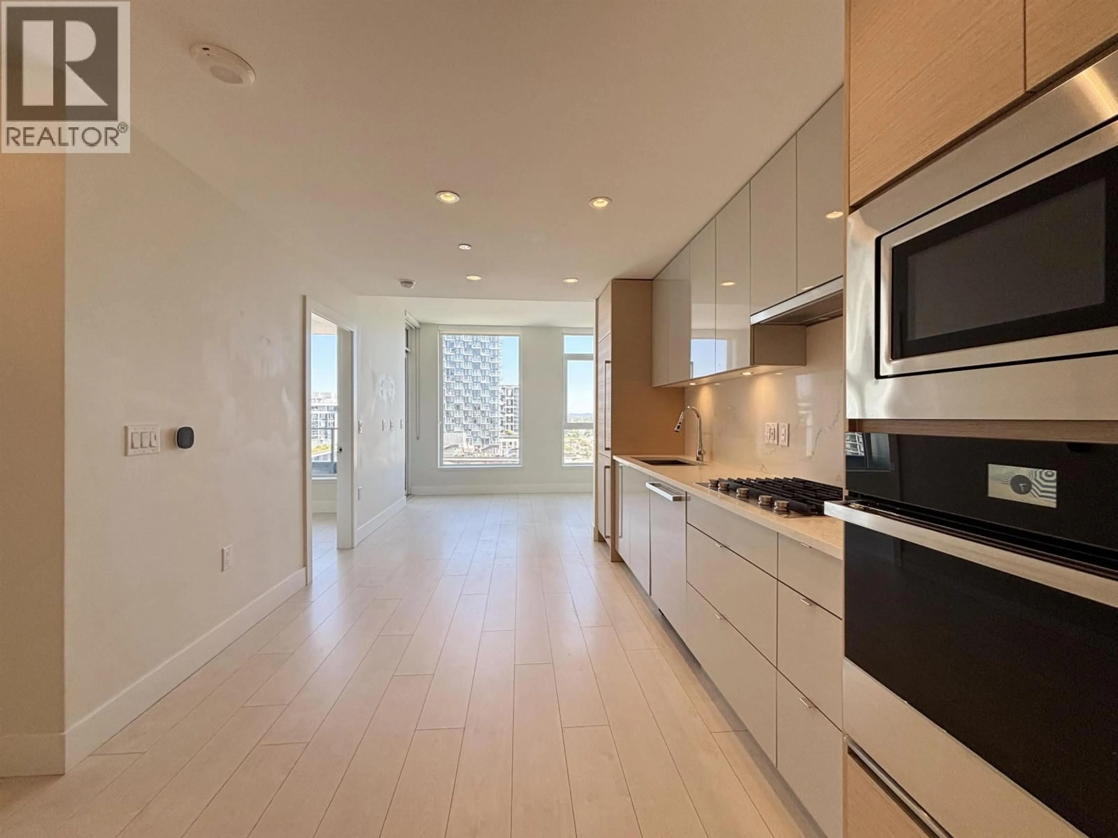 Open concept kitchen, ceramic/tile floor for 1001 - 3438 SAWMILL CRESCENT, Vancouver British Columbia V5S0E3