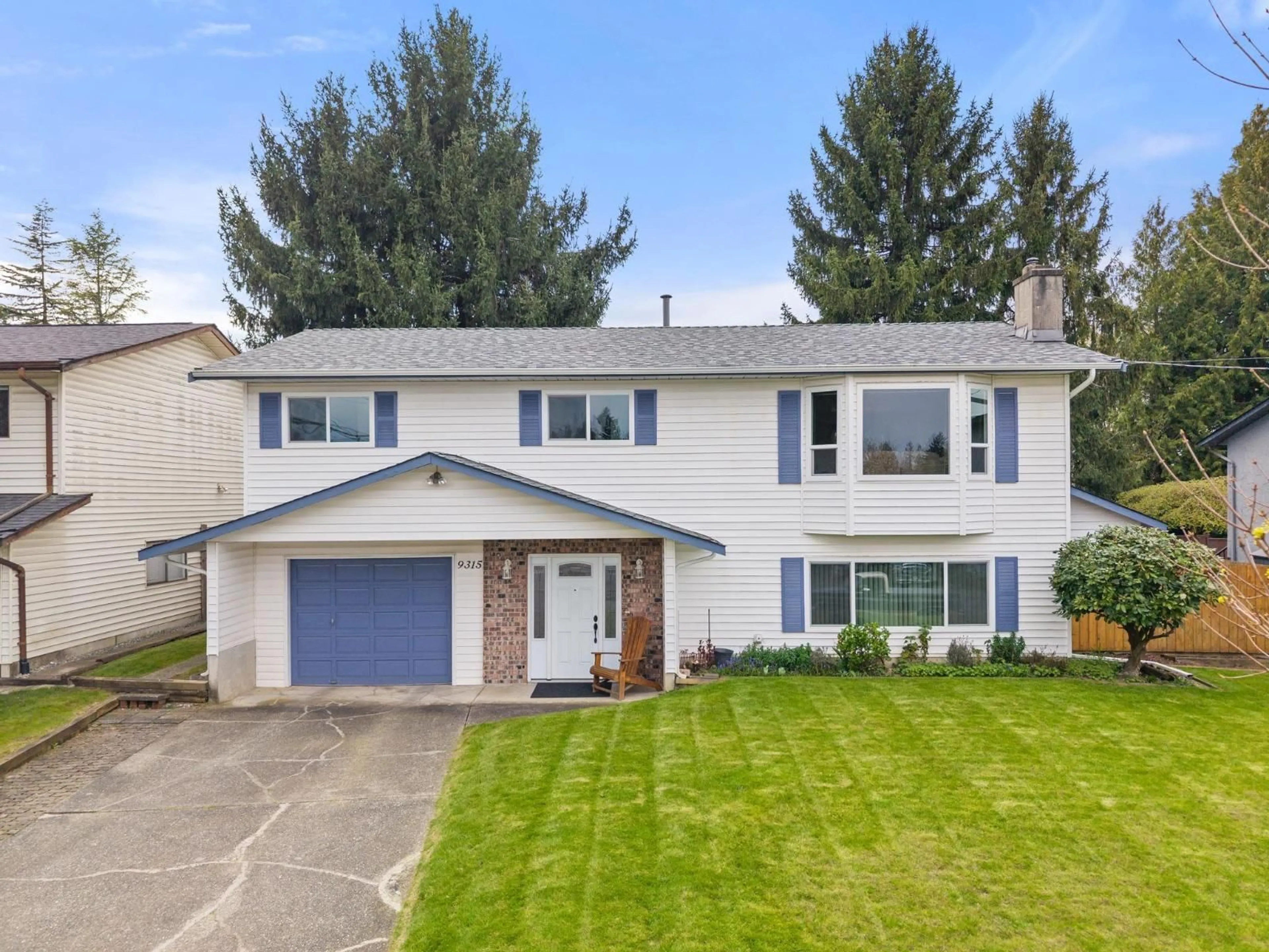 Home with vinyl exterior material, street for 9315 213 STREET, Langley British Columbia V1M1Z6