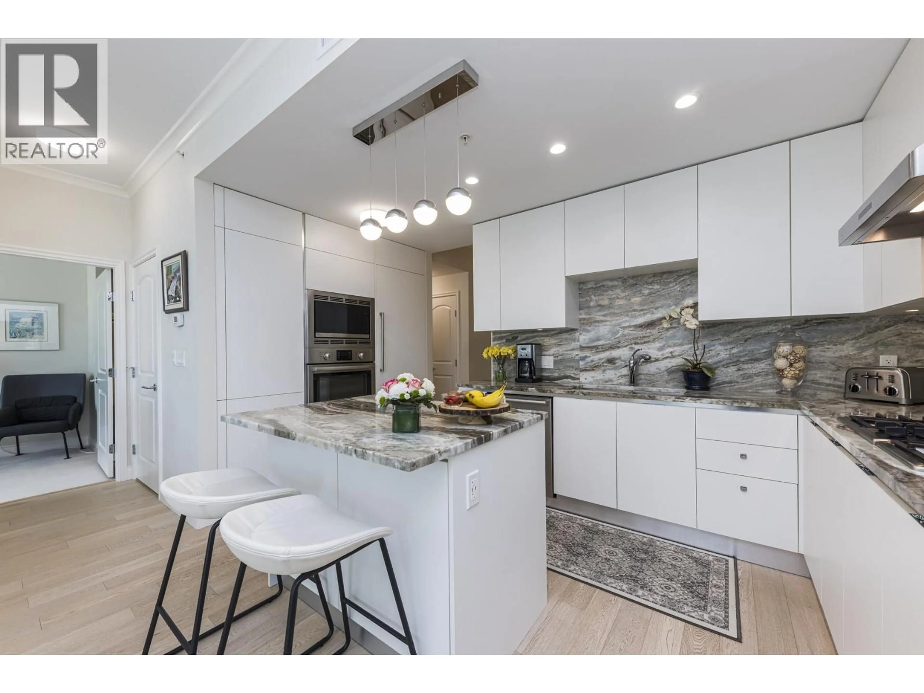 Contemporary kitchen, ceramic/tile floor for 303 - 185 VICTORY SHIP WAY, North Vancouver British Columbia V7L0G2