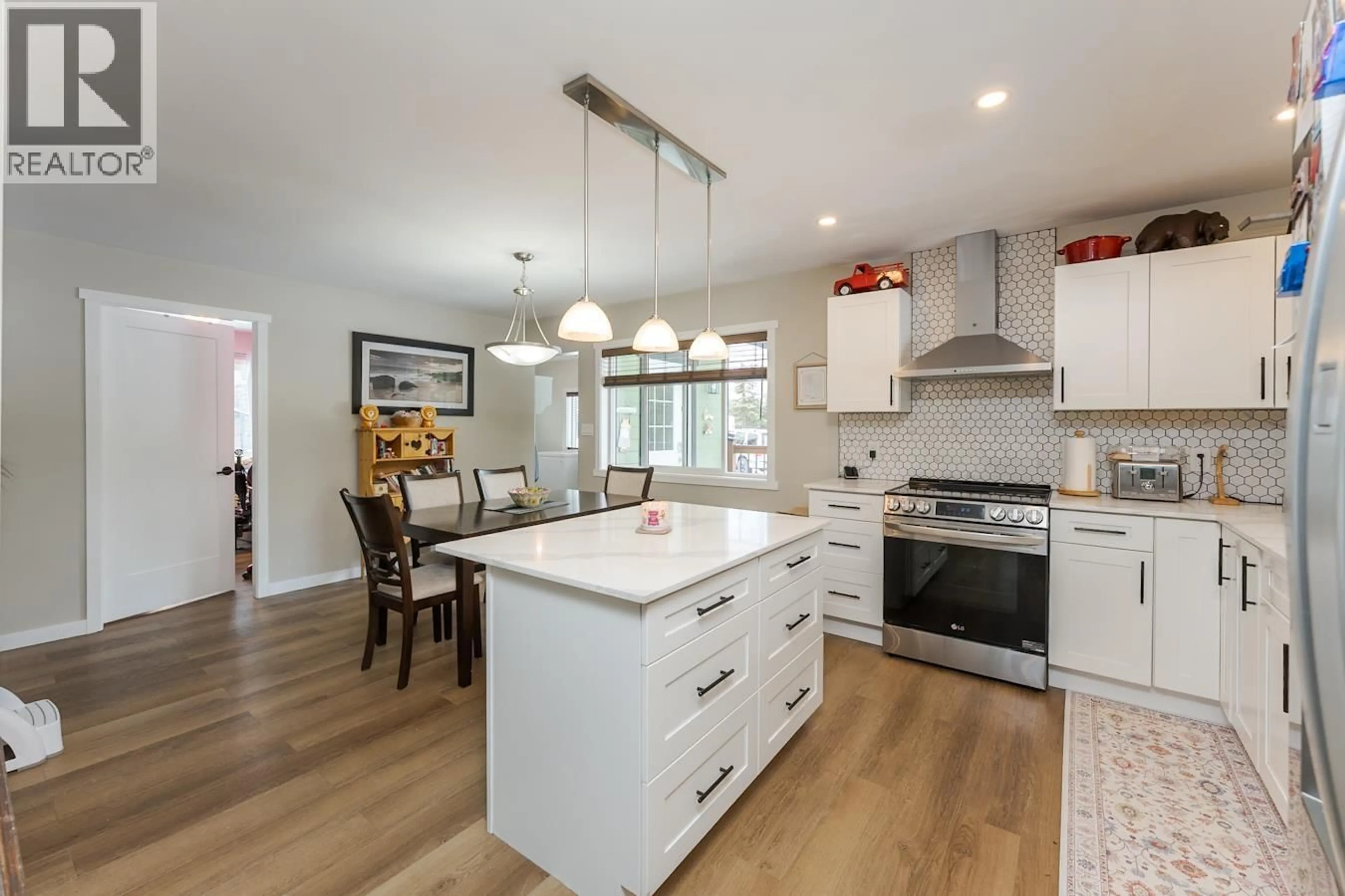 Open concept kitchen, wood/laminate floor for 8785 LYNN DRIVE, Prince George British Columbia V2N6G4