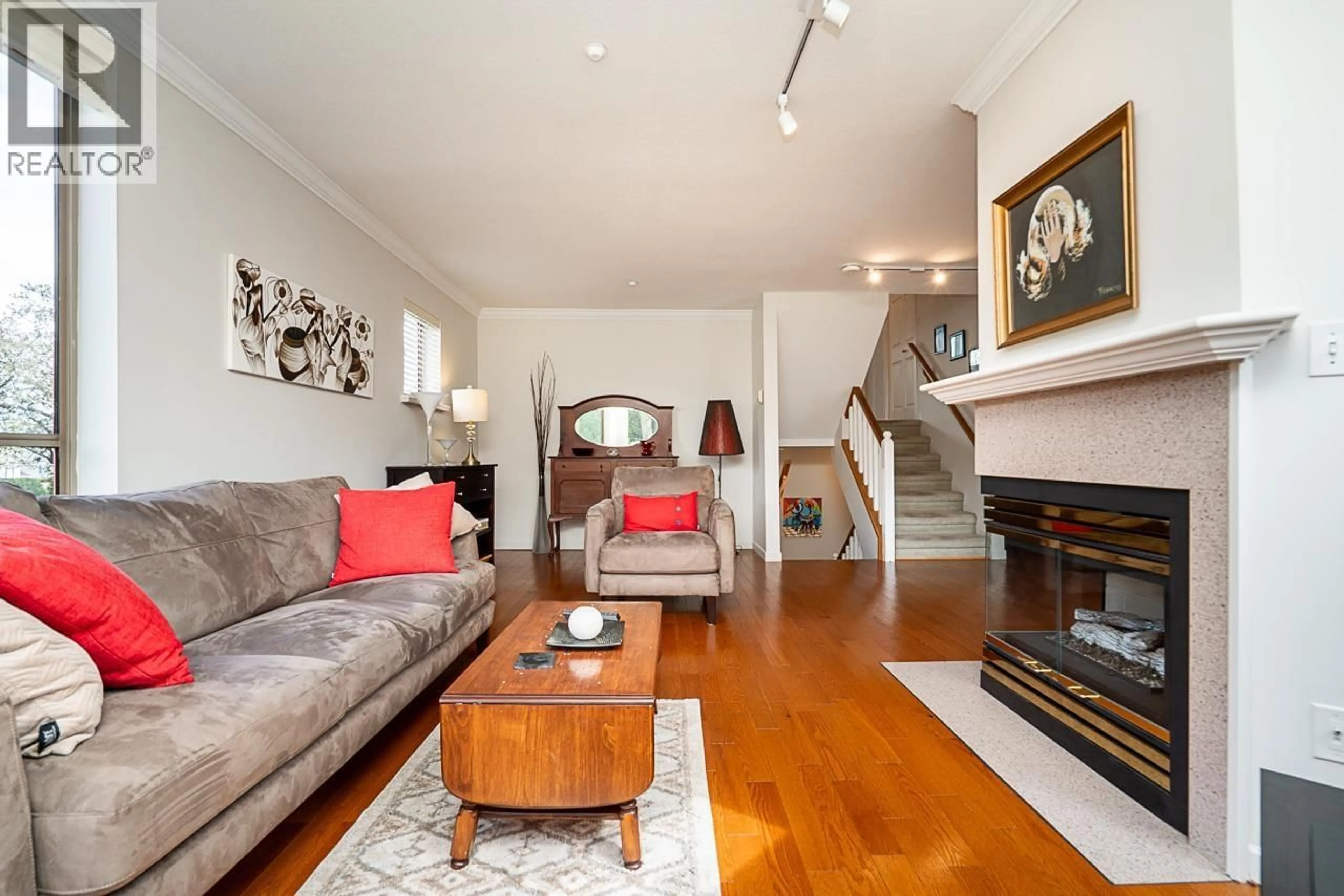 Living room with furniture, wood/laminate floor for 55 - 323 GOVERNORS COURT, New Westminster British Columbia V3L5S6