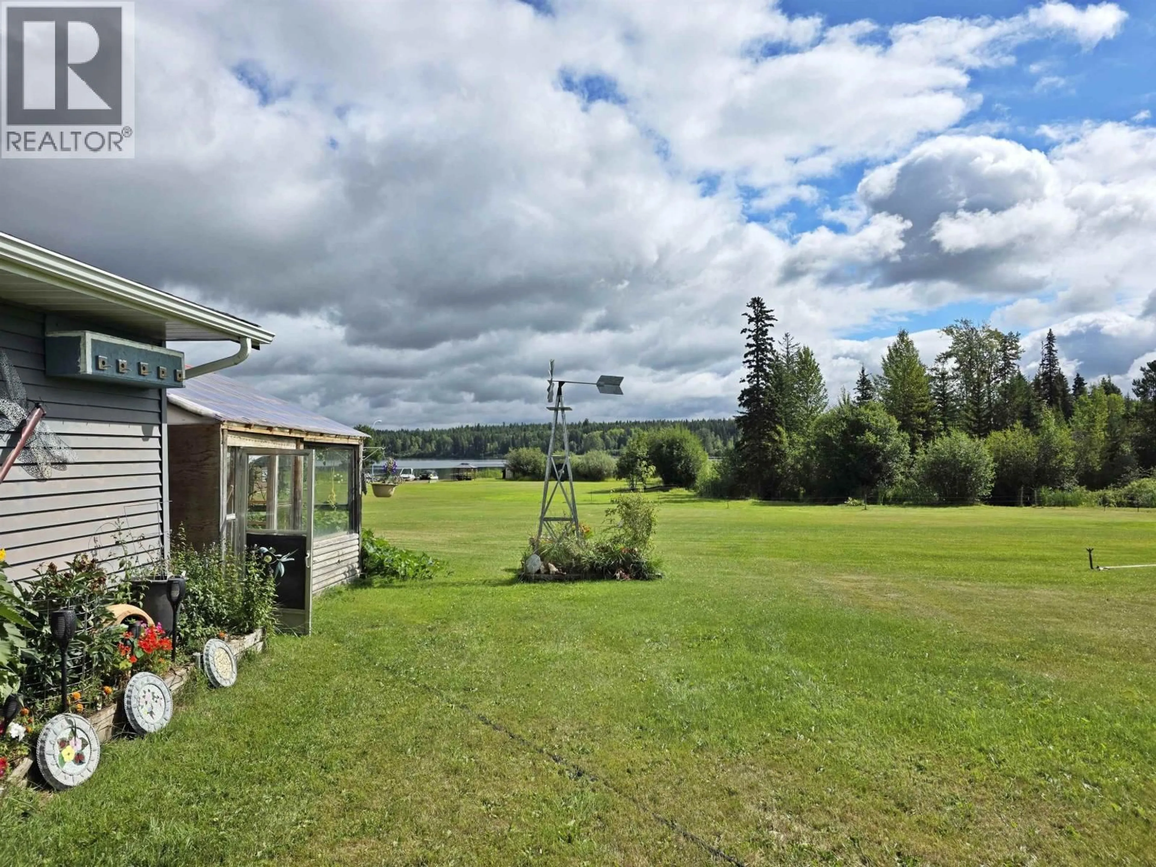 A pic from outside/outdoor area/front of a property/back of a property/a pic from drone, water/lake/river/ocean view for 4812 TEN MILE LAKE ROAD, Quesnel British Columbia V2J6X1