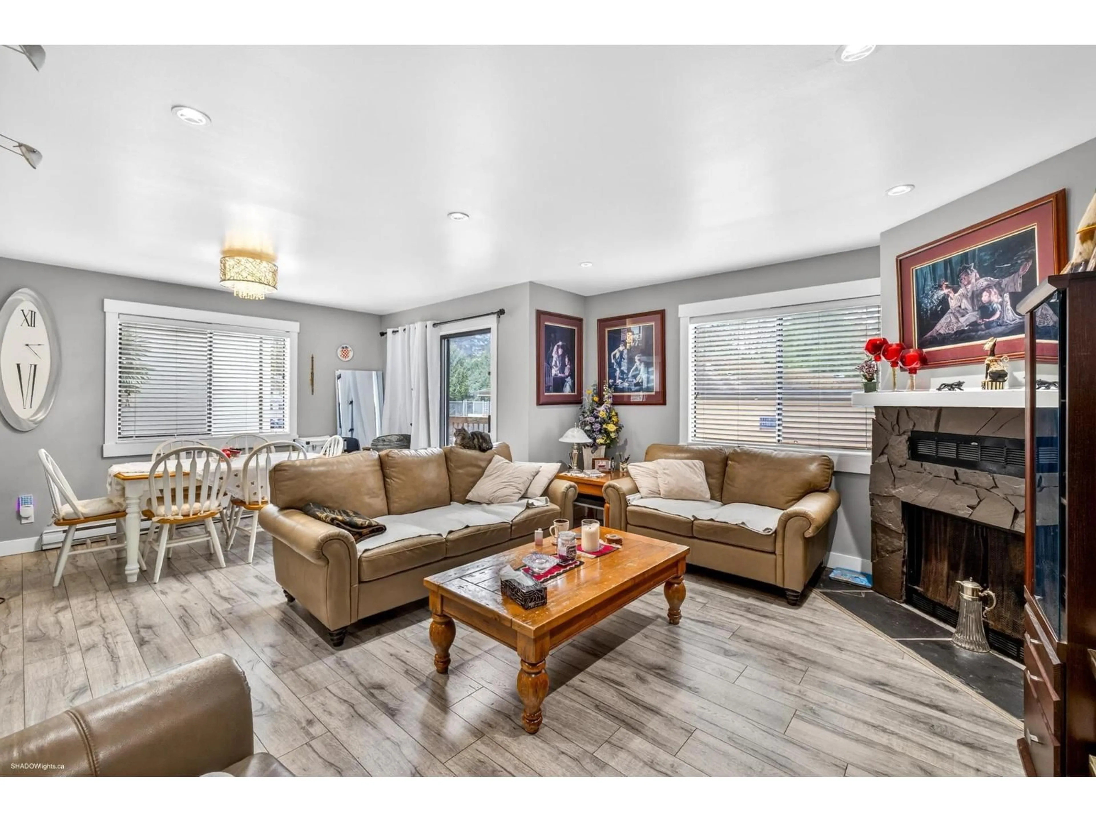 Living room with furniture, wood/laminate floor for 205 - 7139 133A STREET, Surrey British Columbia V3W8A1