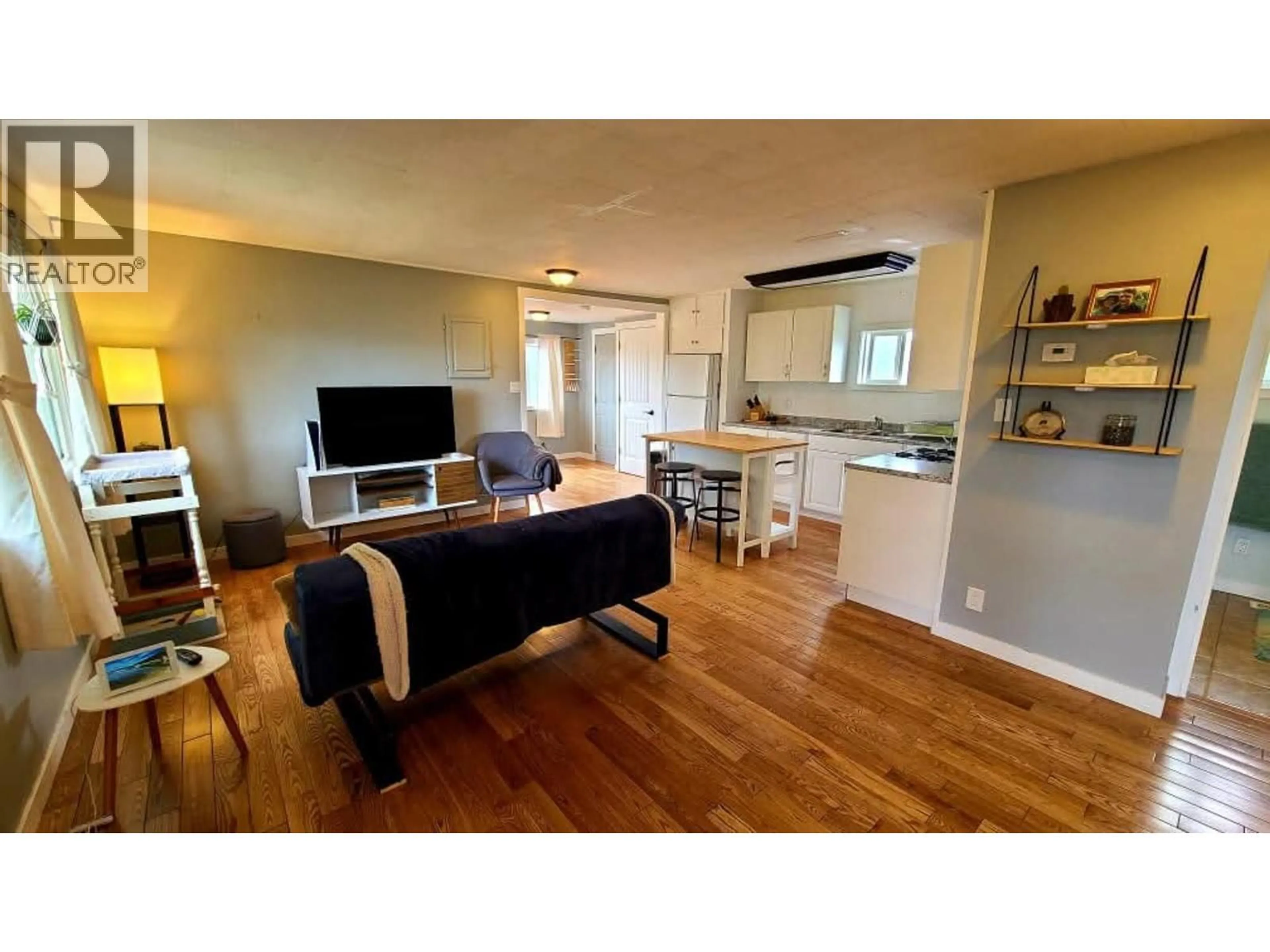 Living room with furniture, wood/laminate floor for 1626 TAMARACK STREET, Prince George British Columbia V2L2T3