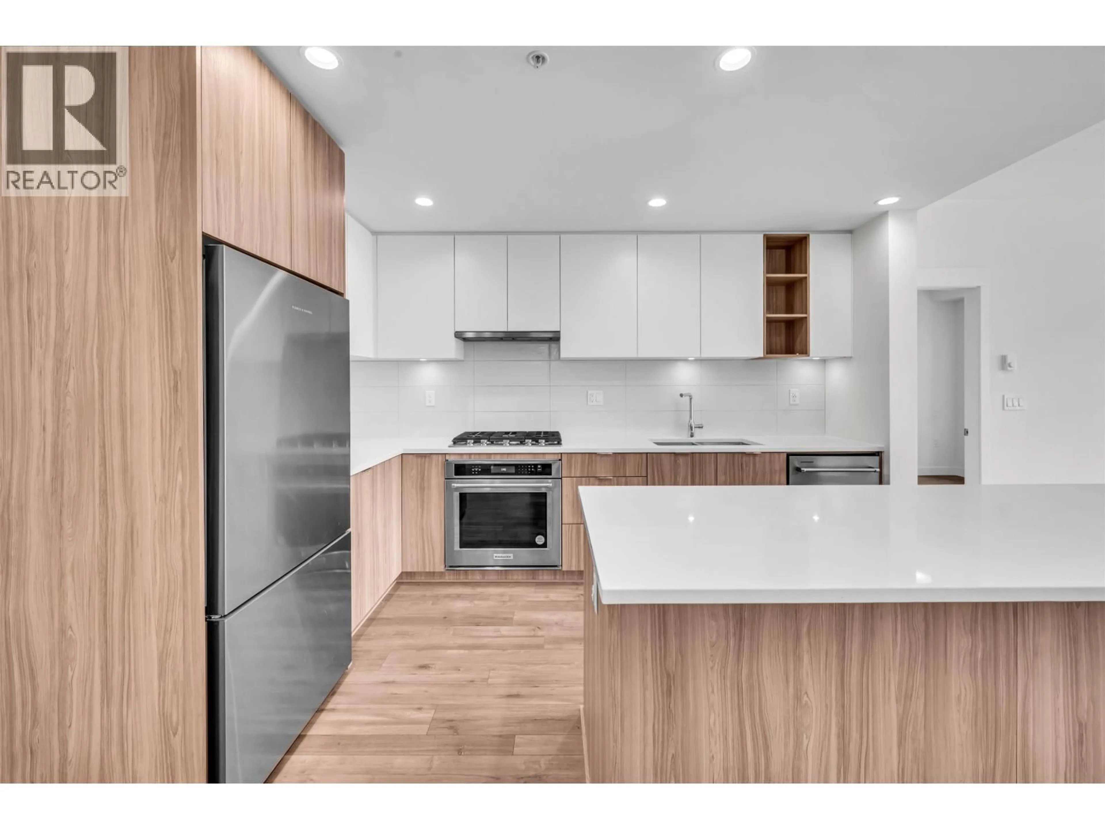 Open concept kitchen, wood/laminate floor for 321 - 750 DOGWOOD STREET, Coquitlam British Columbia V3J0K6