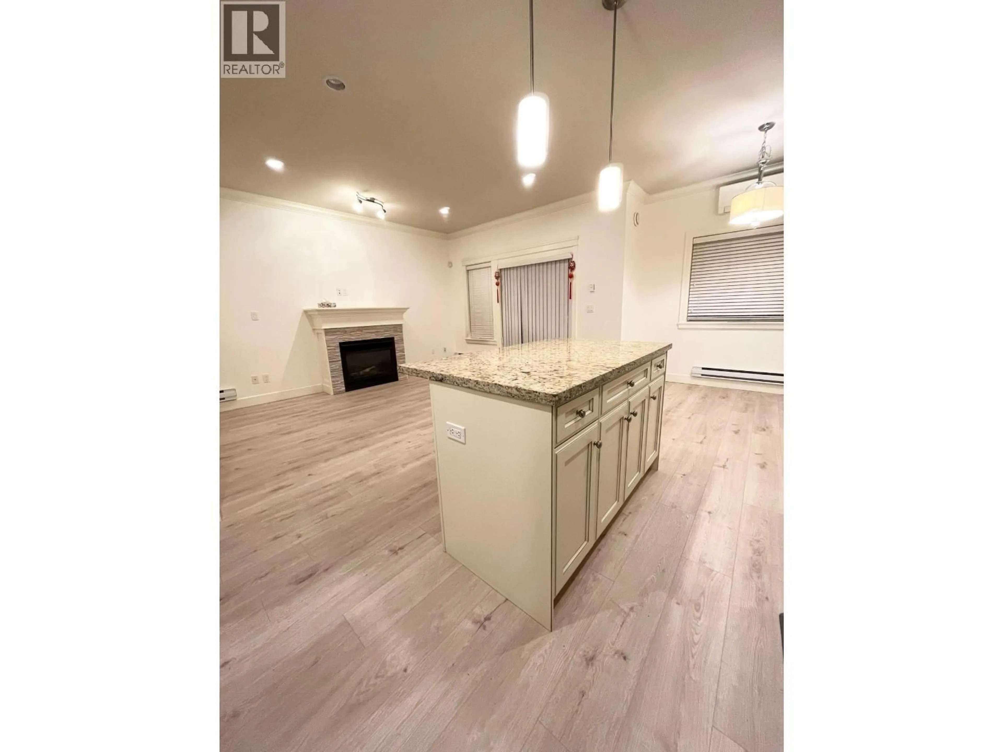 Open concept kitchen, wood/laminate floor for 10 - 8091 WILLIAMS ROAD, Richmond British Columbia V7A1G4
