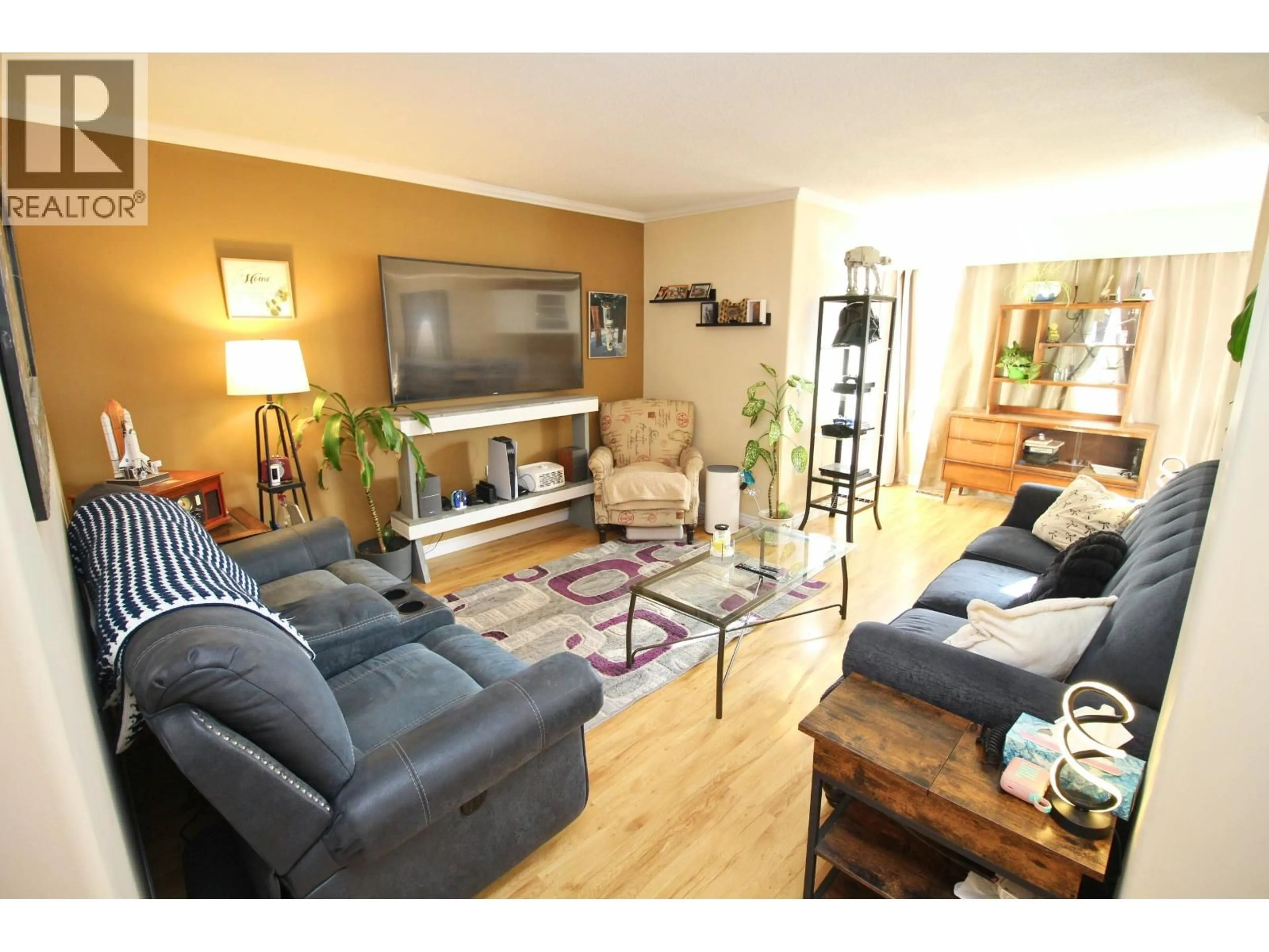 Living room with furniture, wood/laminate floor for 2201 CATALINE COURT, Houston British Columbia V0J1Z0